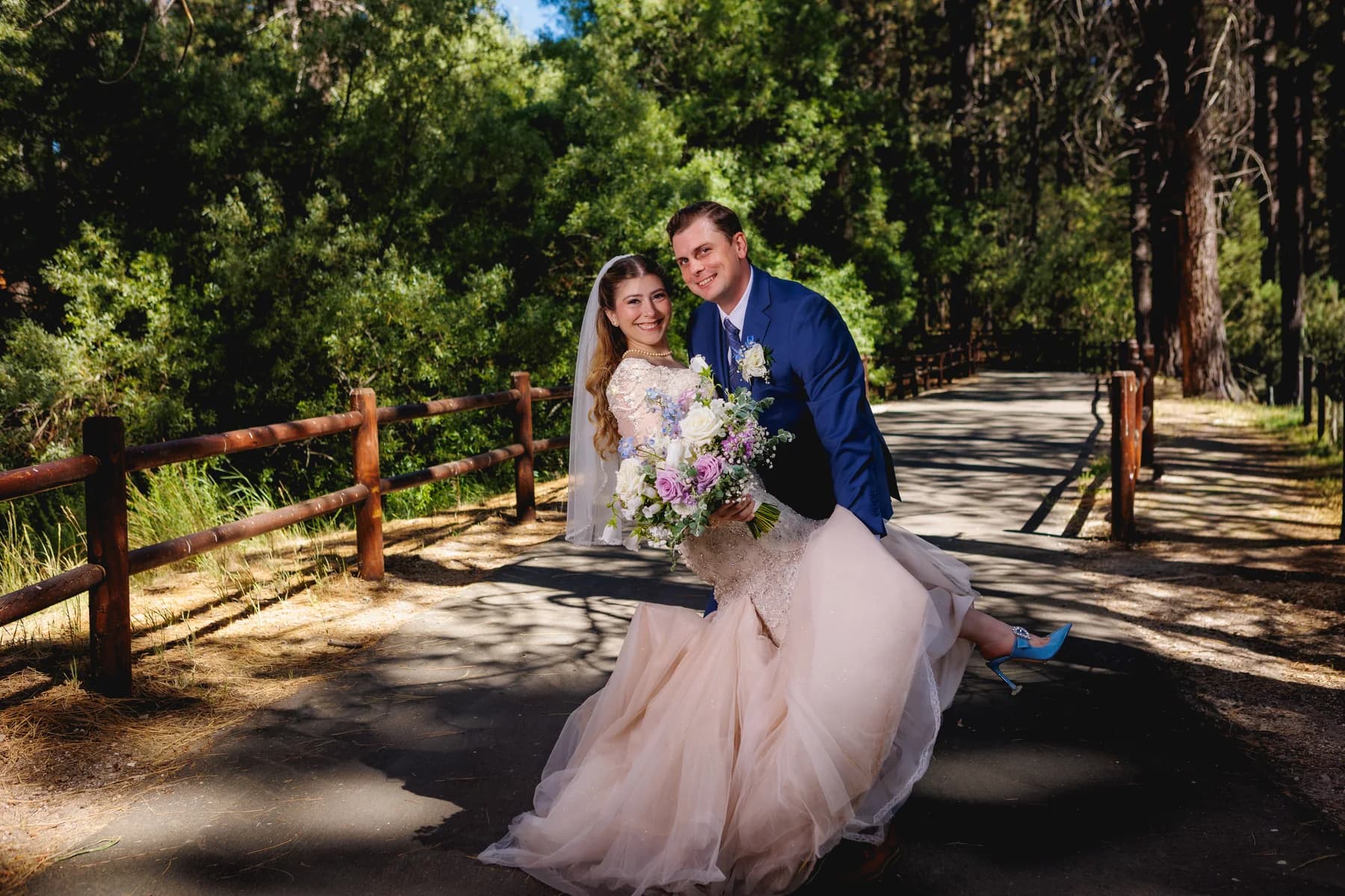 Gloria and Ryan on a wooded path in mixed sun and shade
