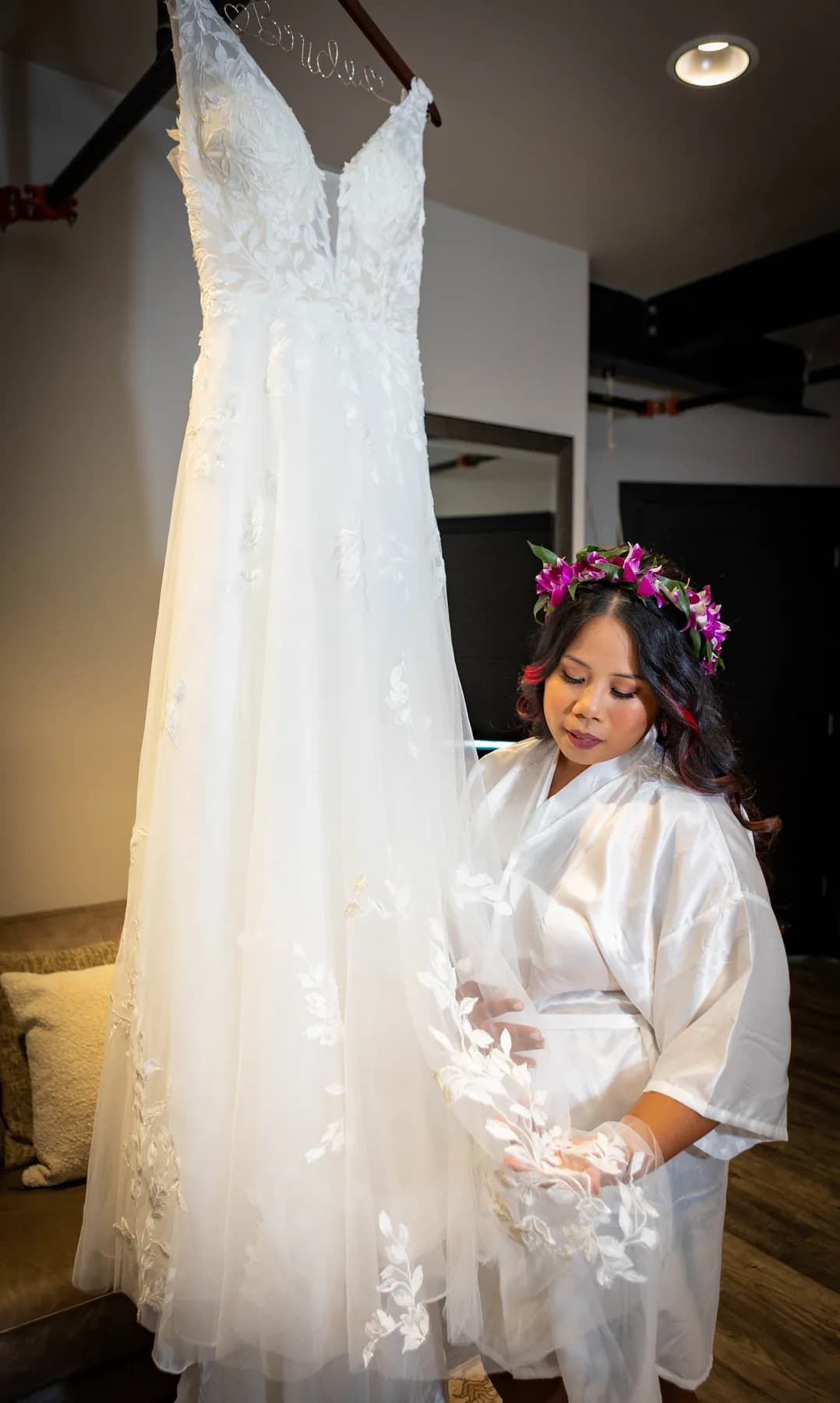 Azalea sitting beneath her hanging wedding dress