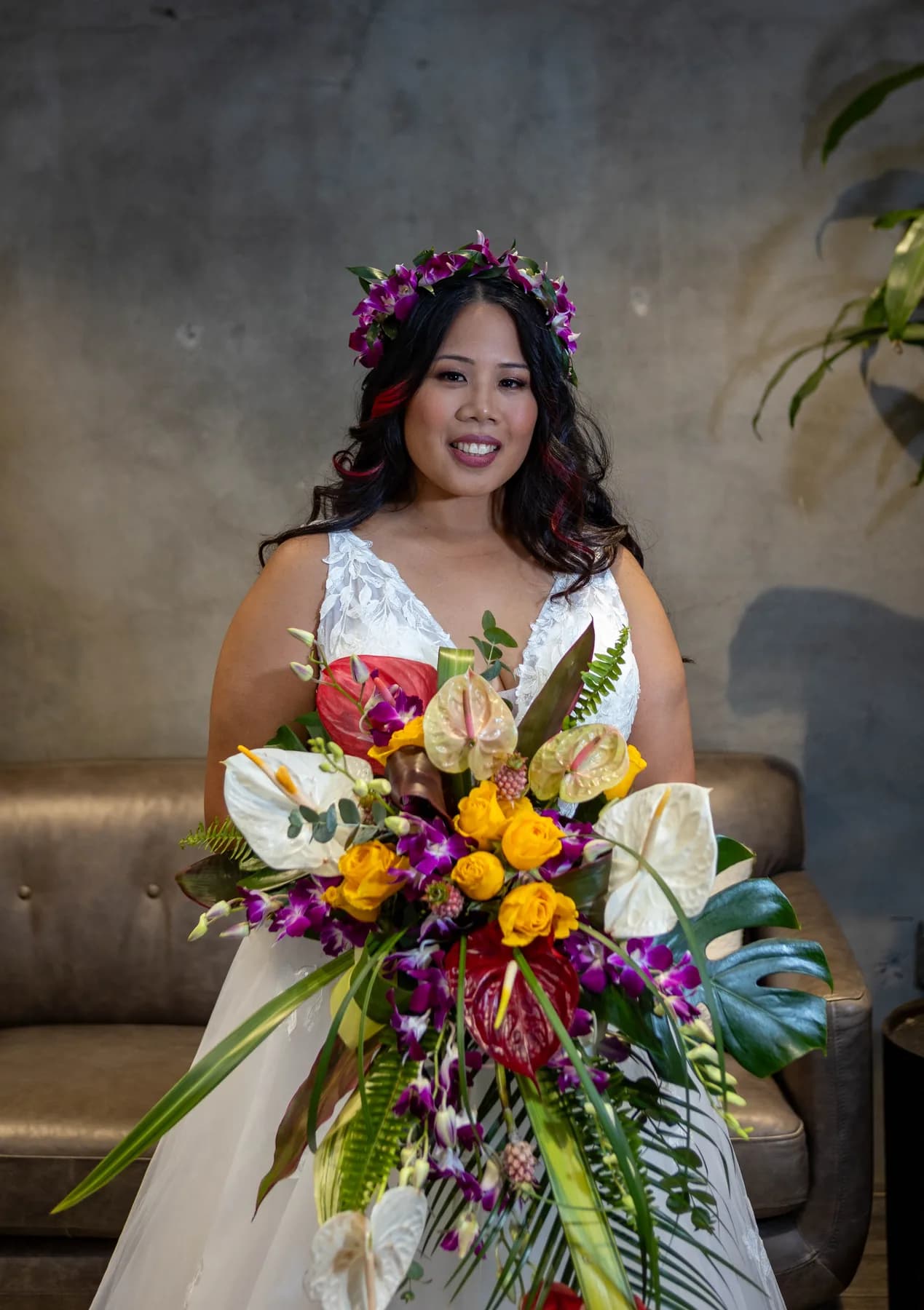 Azalea holding a colorful bouquet against a concrete wall