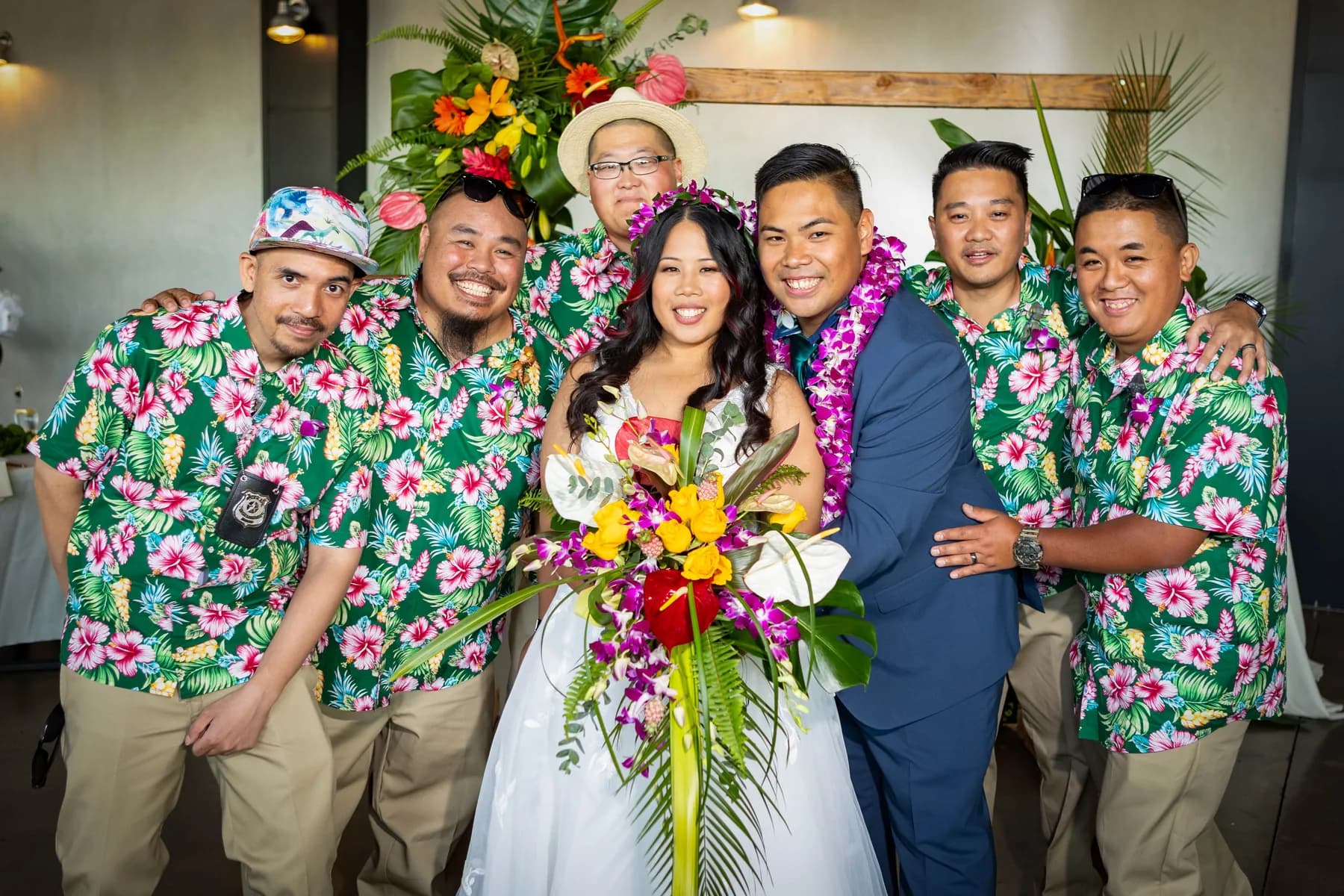 Jed and Azalea smiling with a small group of attendants