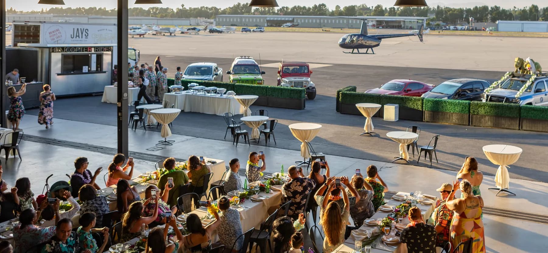 Guests watching the helicopter arrive at the Fullerton airfield
