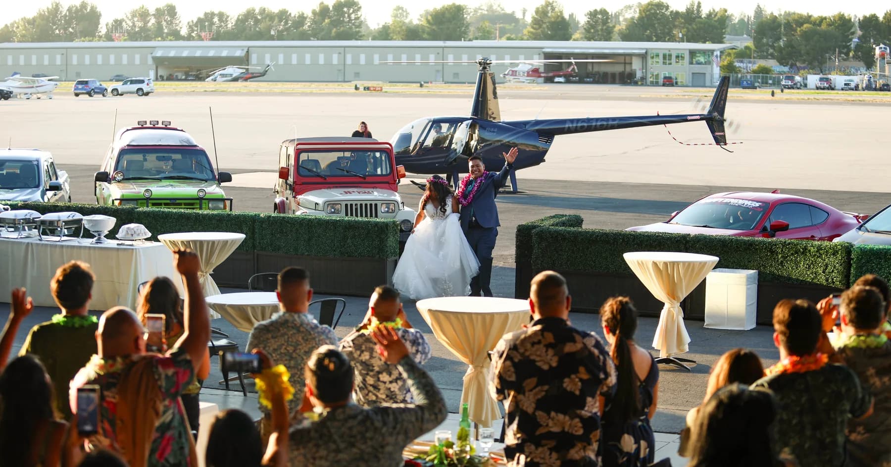 Guests greeting Jed and Azalea beside the helicopter