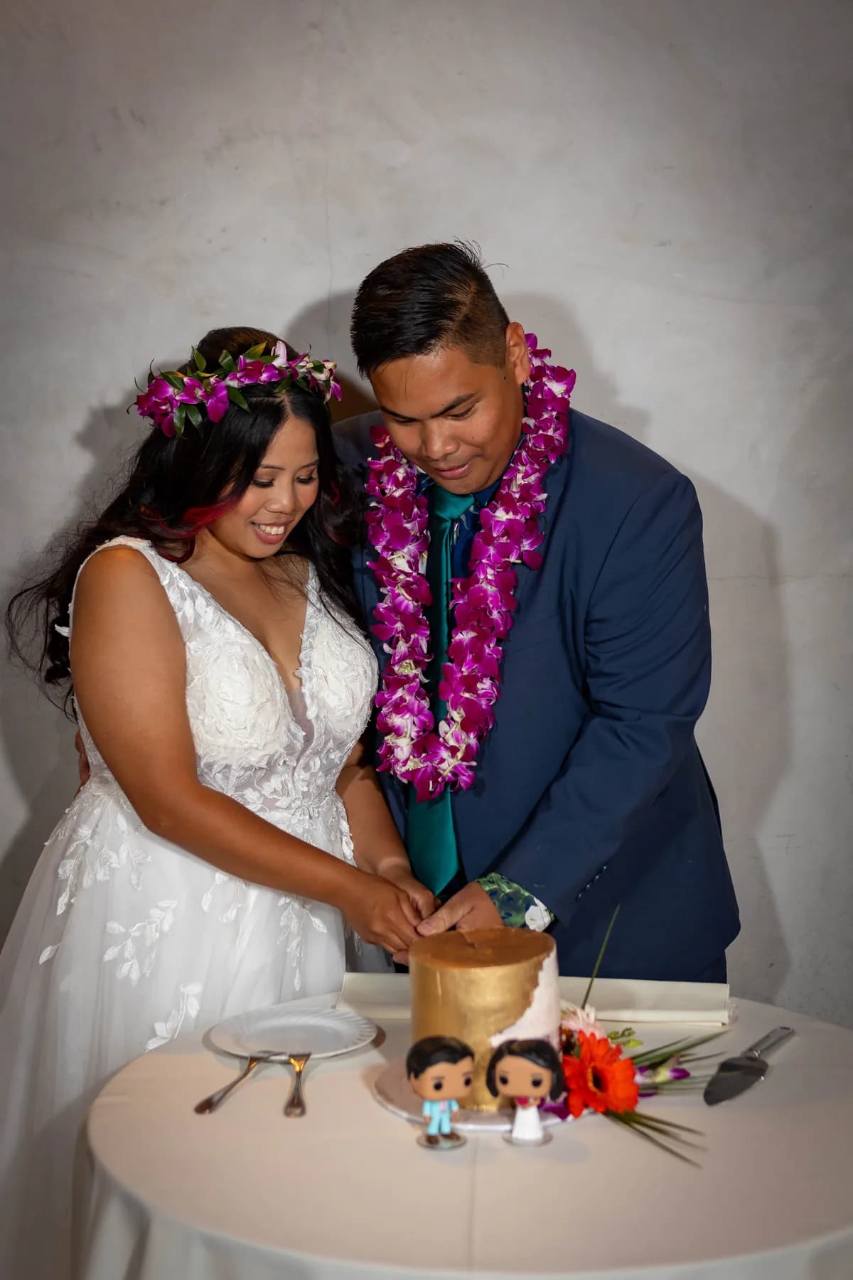 Jed and Azalea cutting their wedding cake