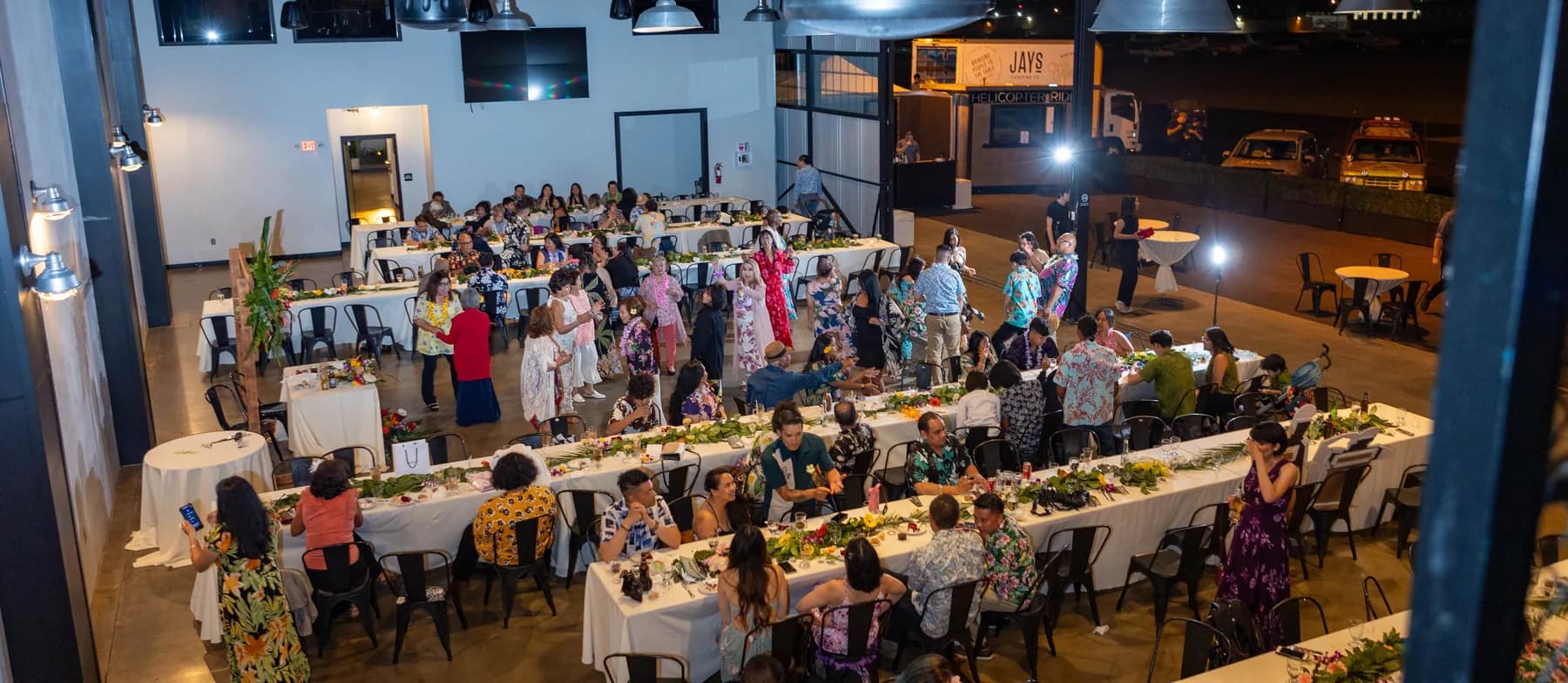 Wide view of guests celebrating inside Hangar 21 South