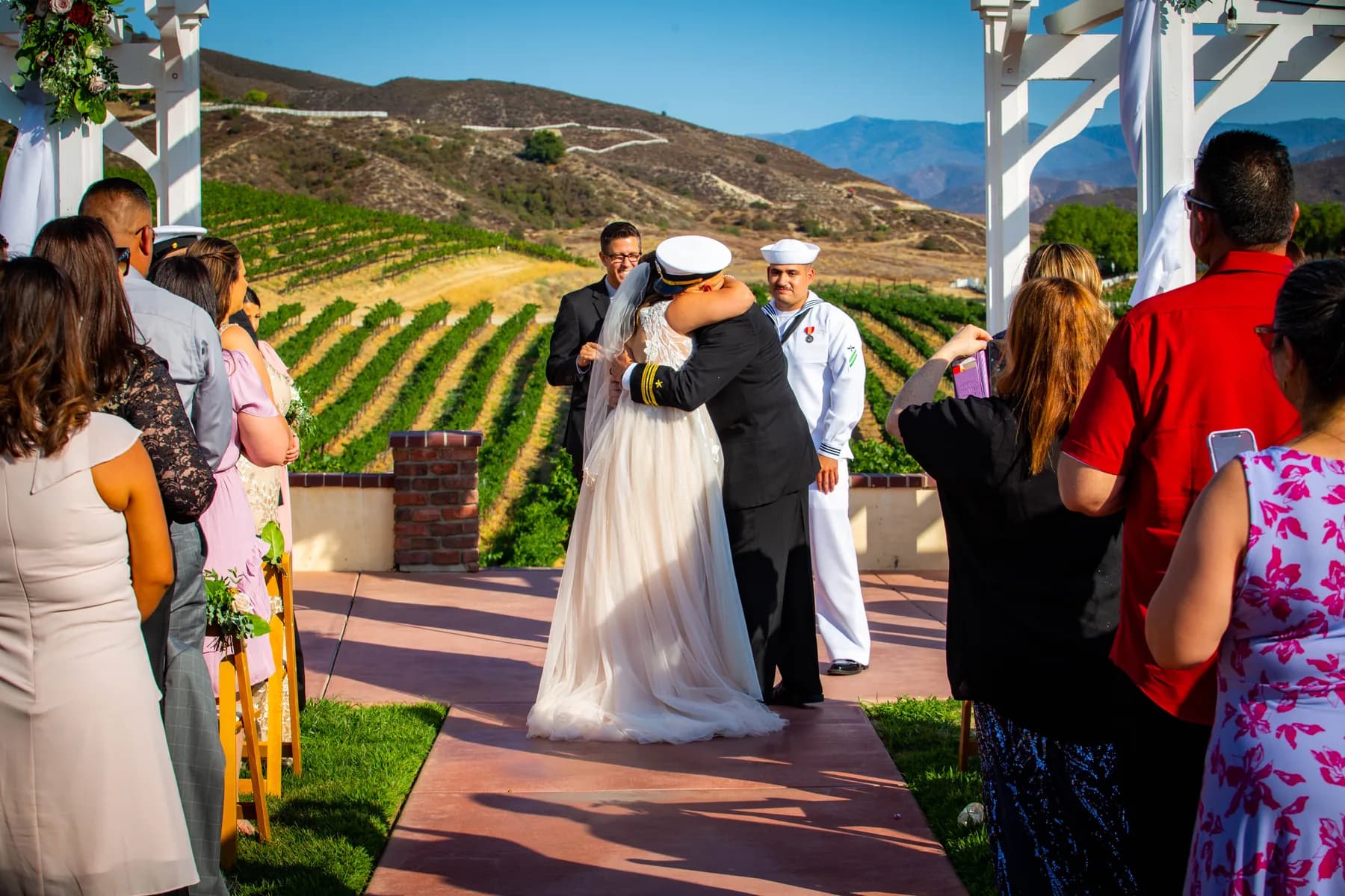 Deidriana greeting Gustavo at the ceremony aisle