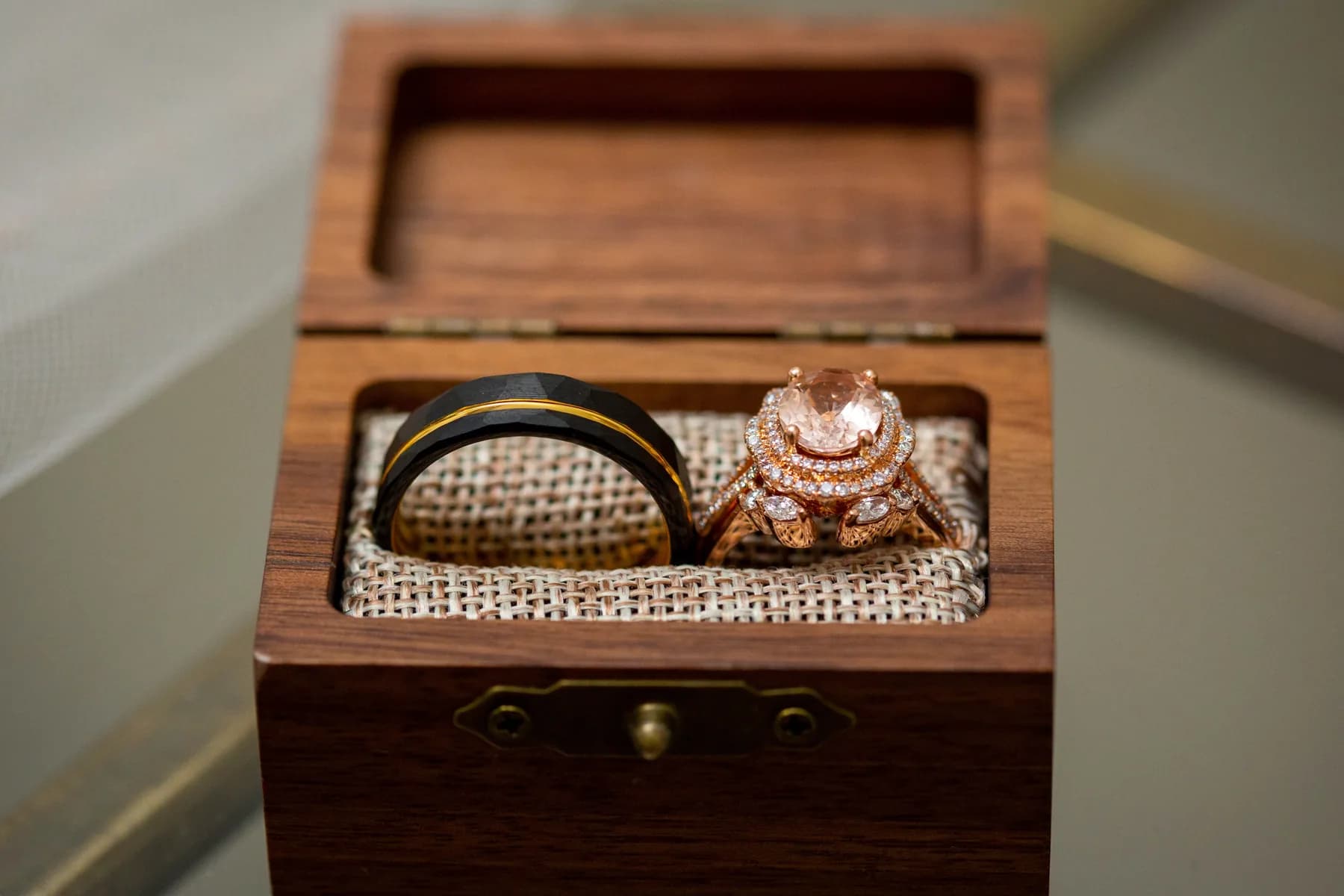 Wedding rings arranged inside a wooden ring box before the ceremony