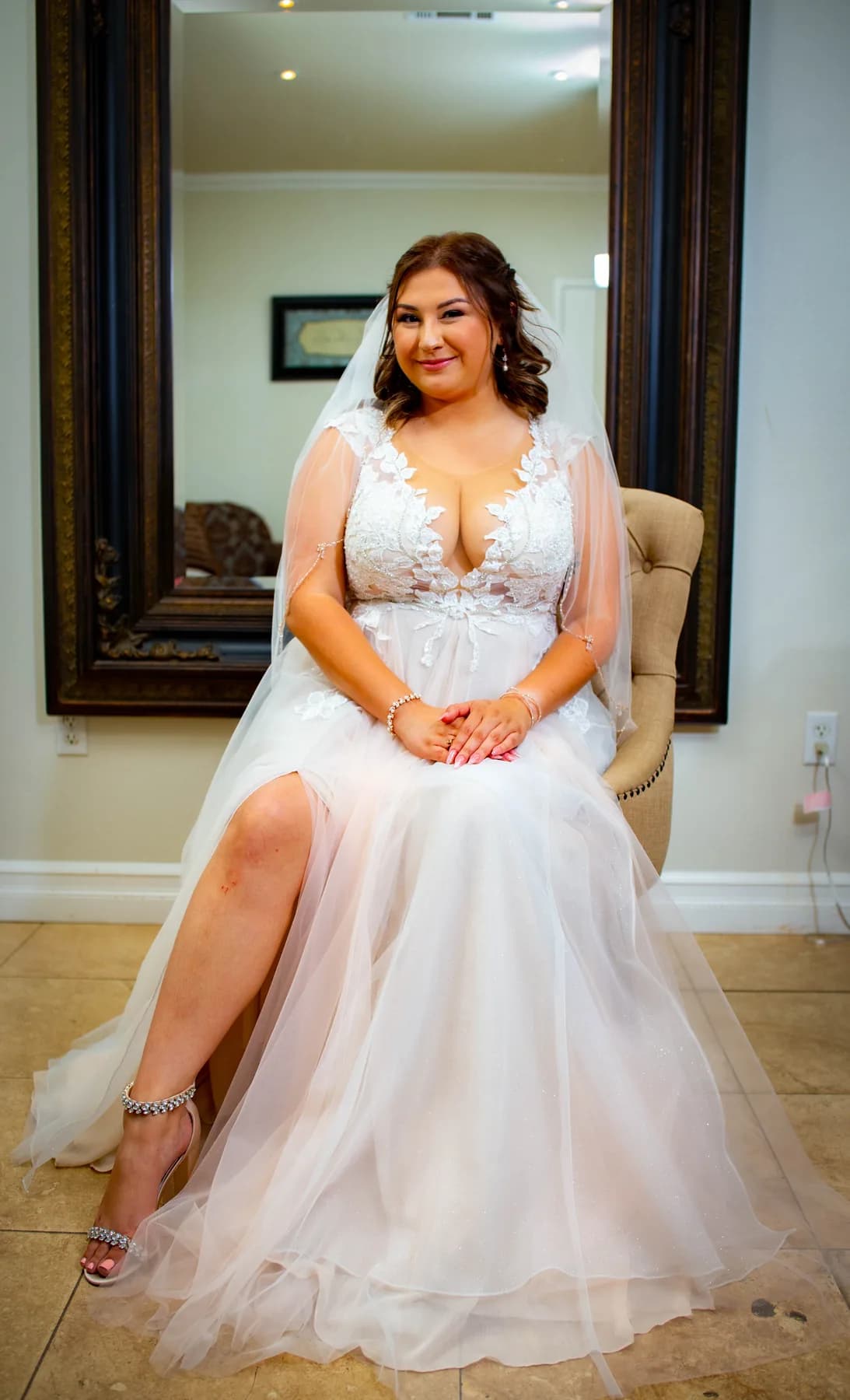 Deidriana seated in her wedding dress before the ceremony