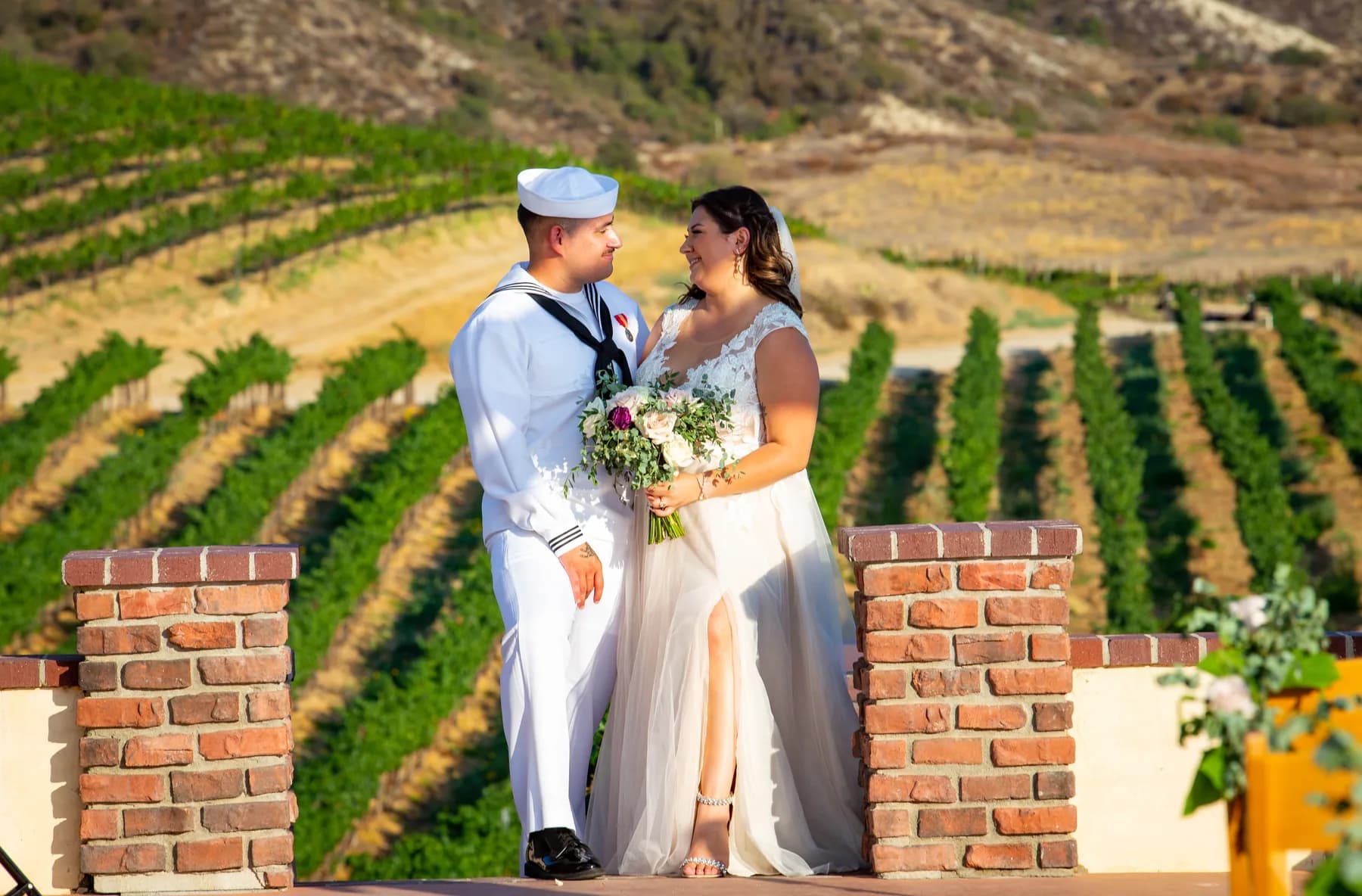 Newlyweds together above the vineyard rows at Leoness Cellars