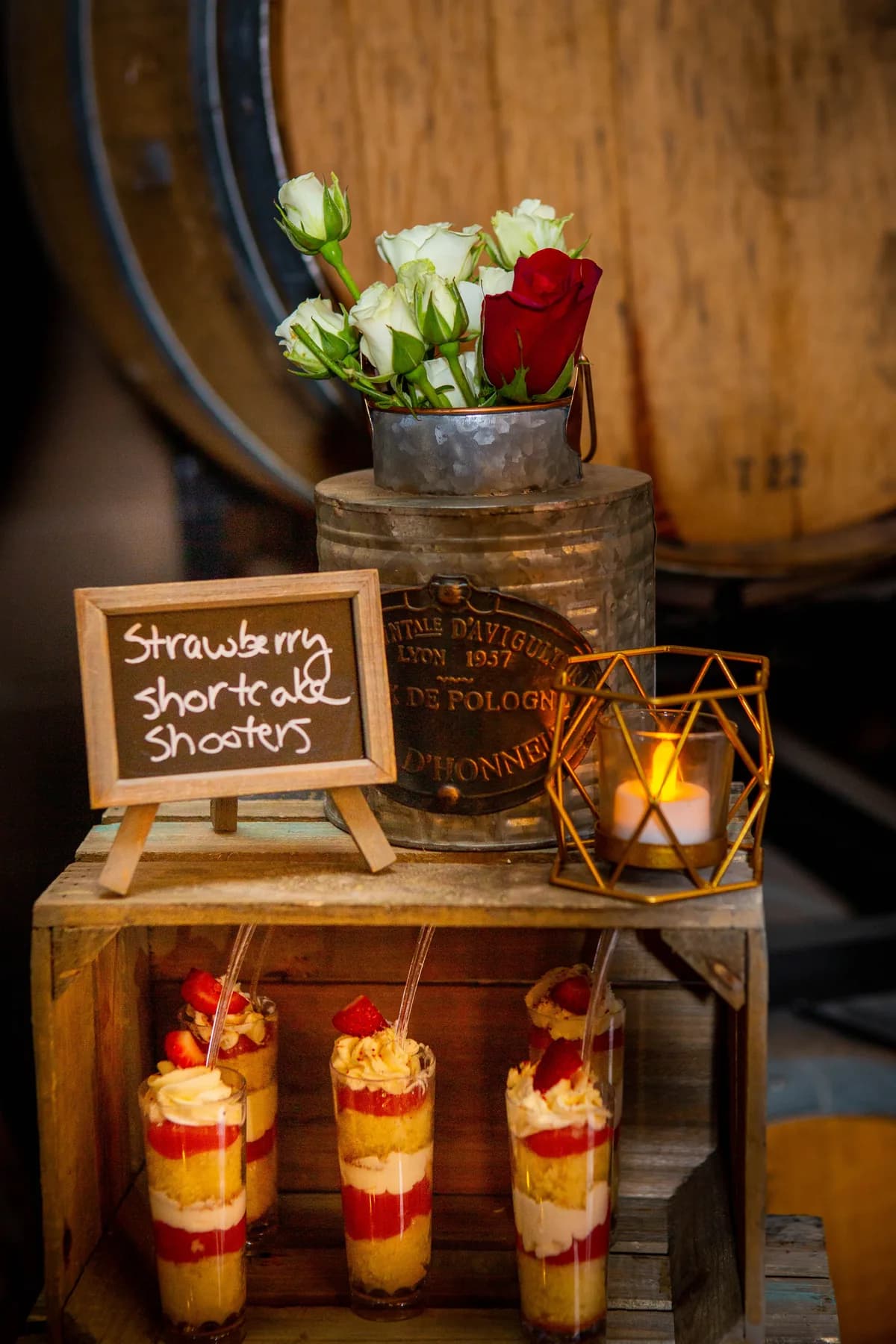 Small reception favors displayed beside a floral arrangement
