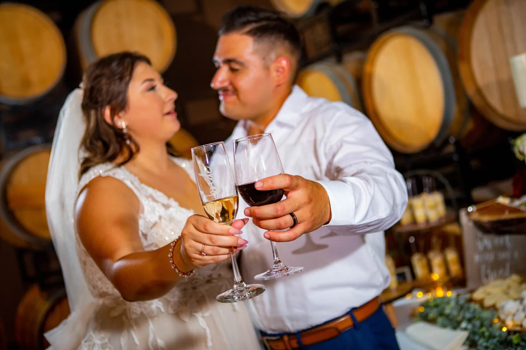 Deidriana and Gustavo raising glasses during the reception