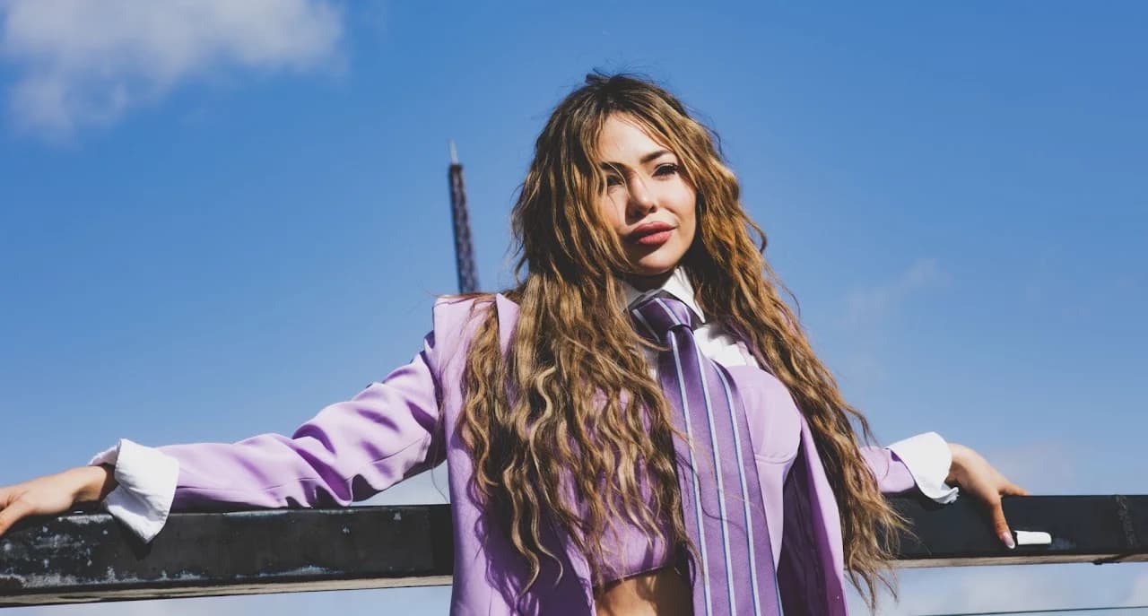 Wide rooftop portrait in a lavender suit