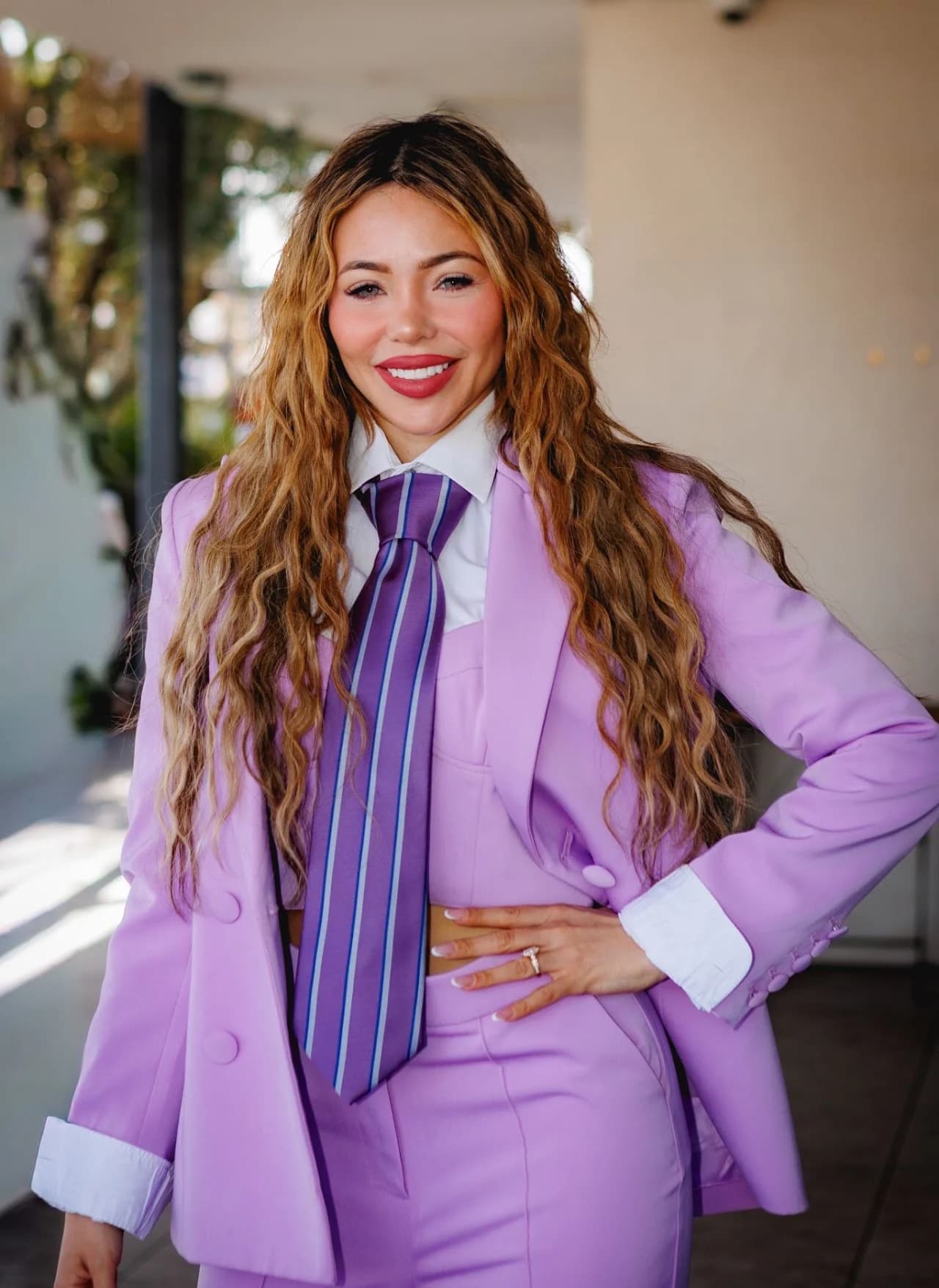 Lavender suit and striped tie portrait
