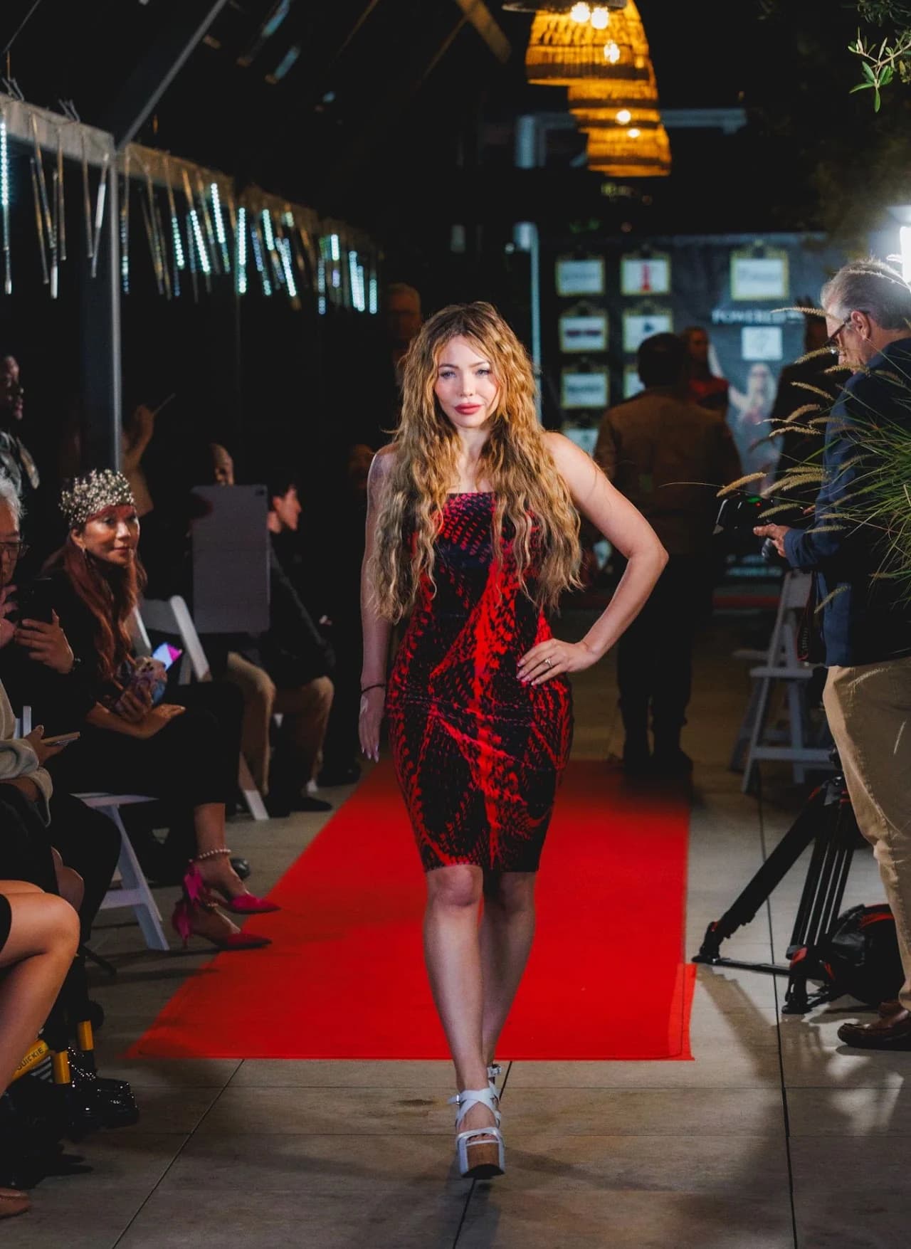 Full-length runway photograph in a patterned dress