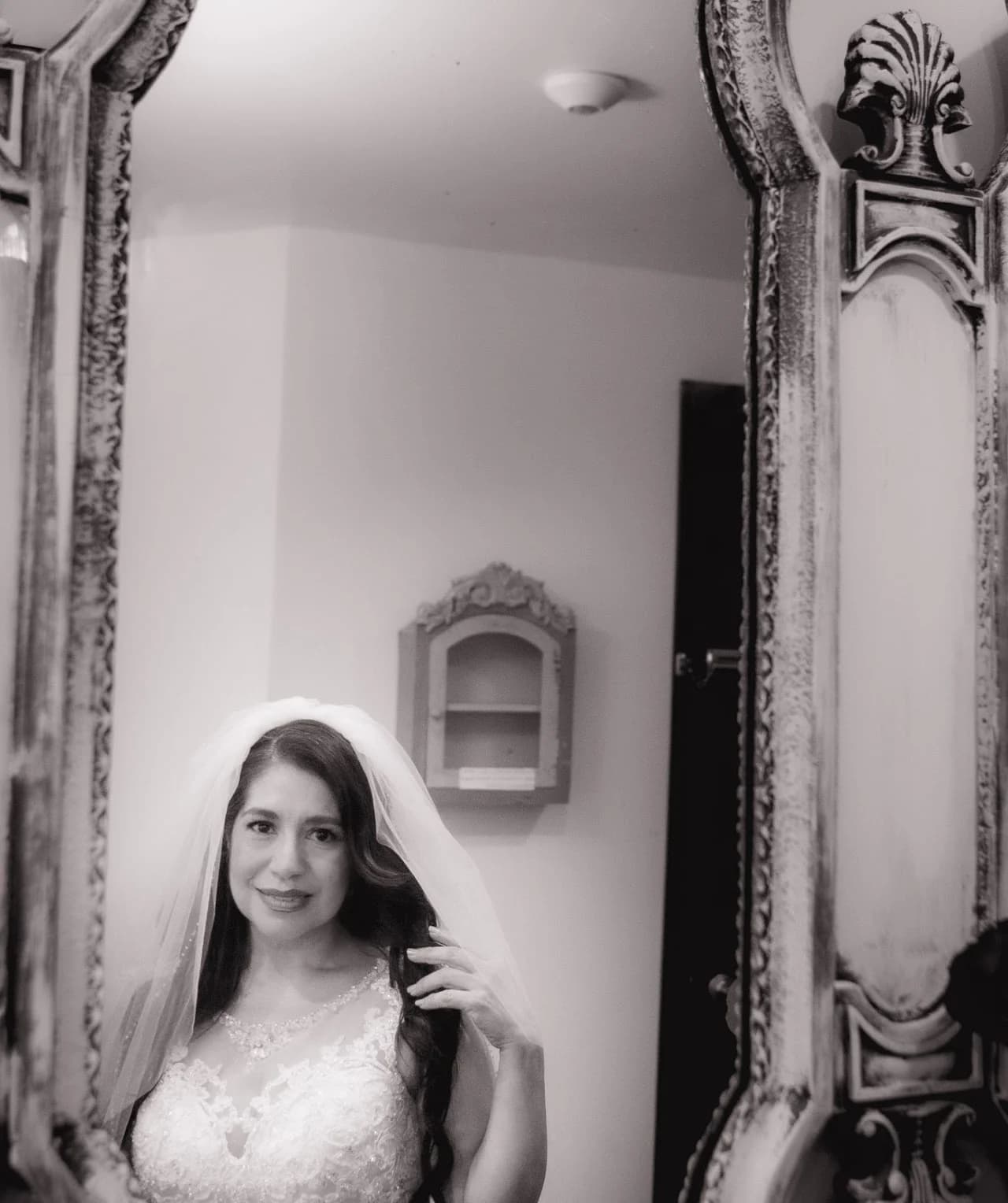 Black-and-white seated portrait during preparations