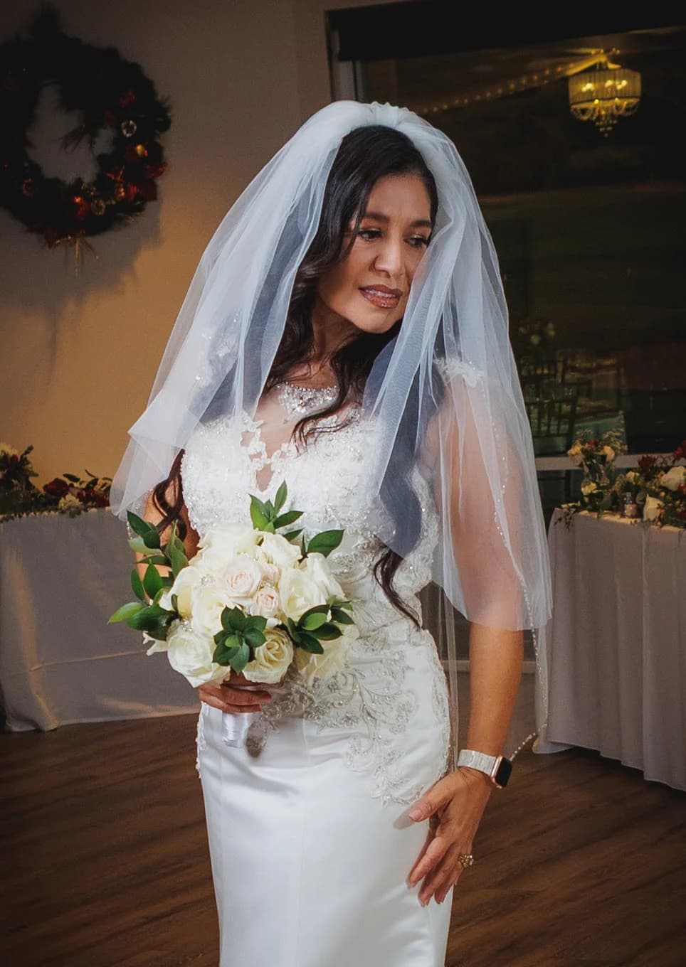 Woman holding a bouquet during preparations