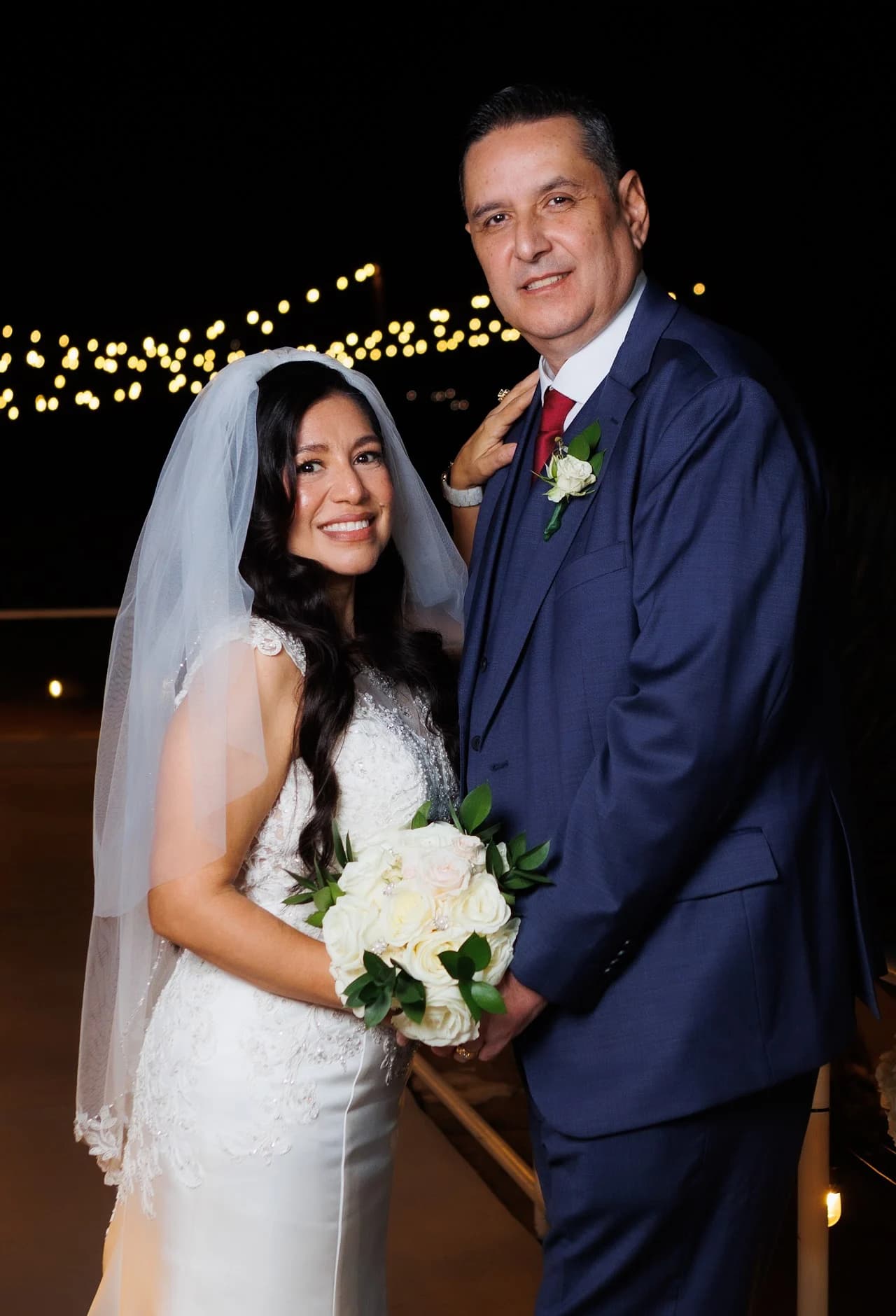Couple standing close together after dark