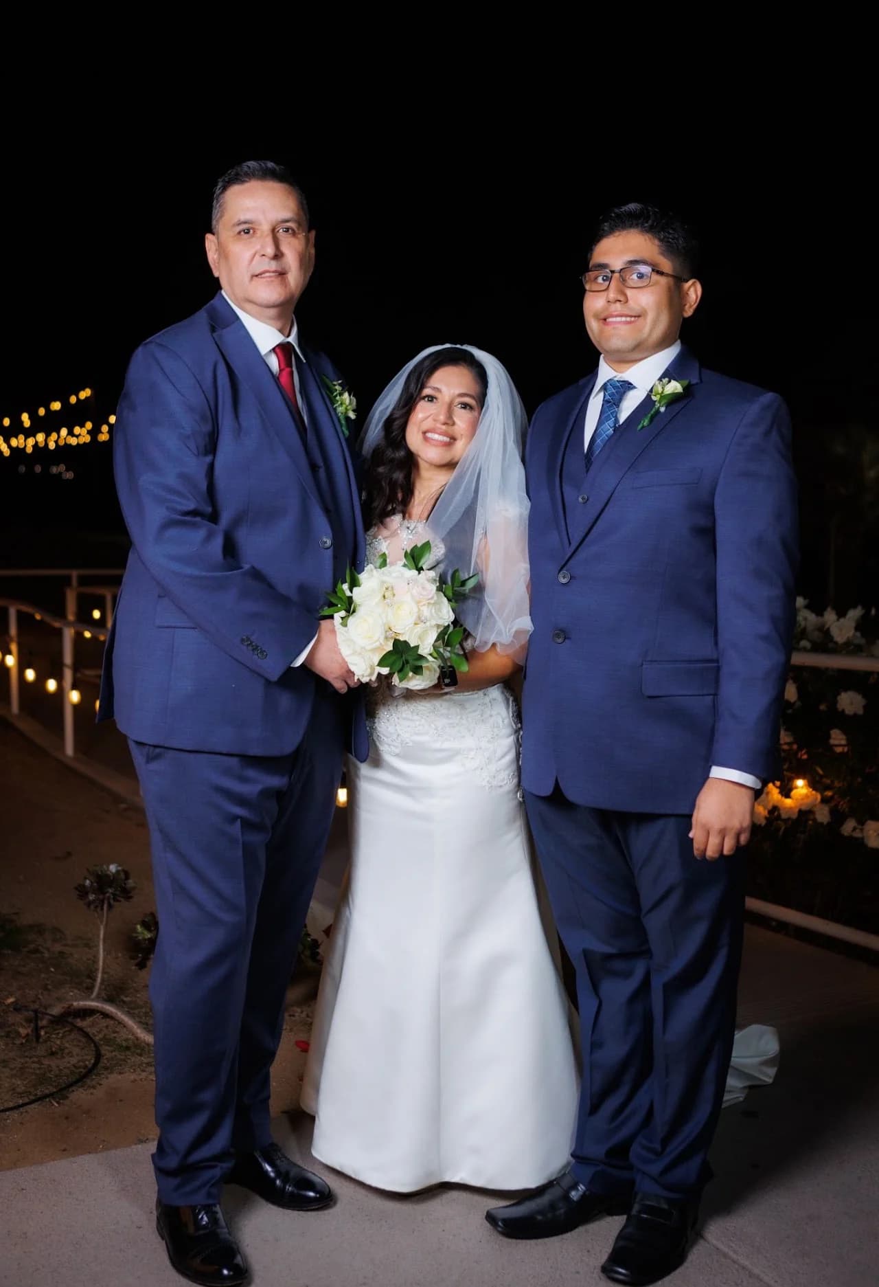 Three-person formal portrait outside
