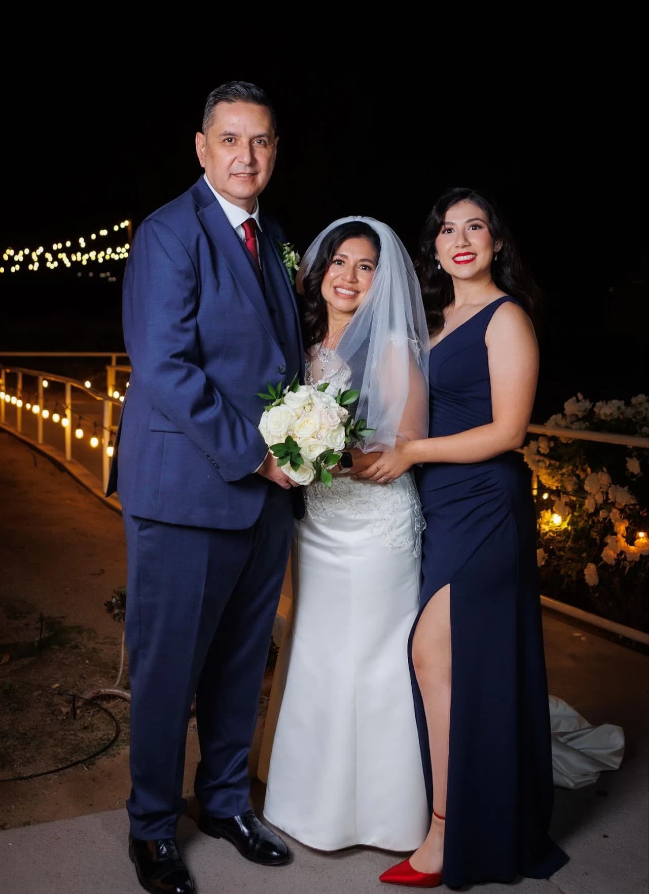 Two-person evening portrait with a bouquet