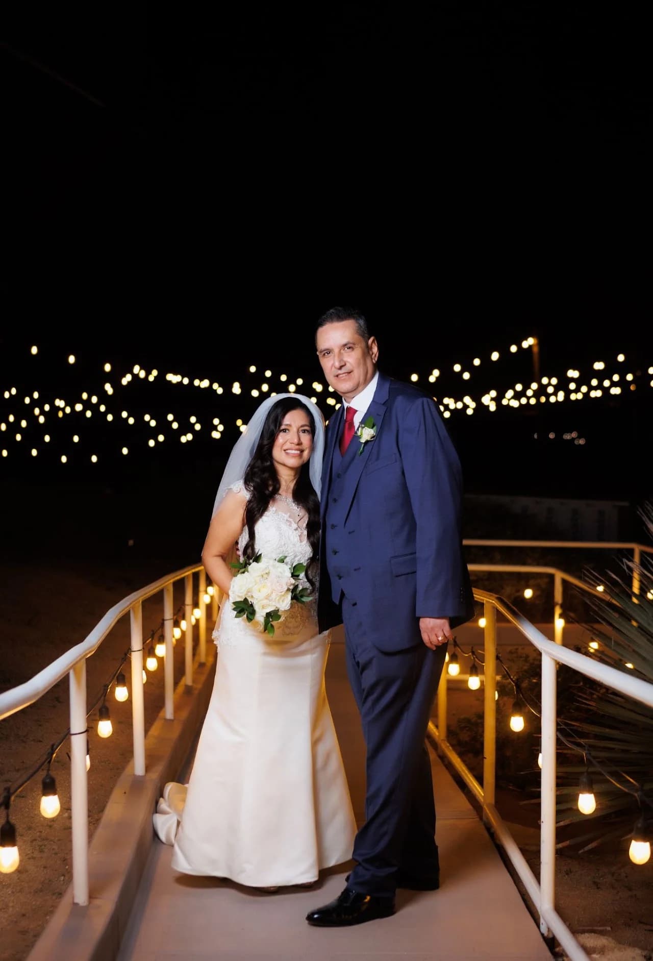 Full-length portrait of the couple holding hands