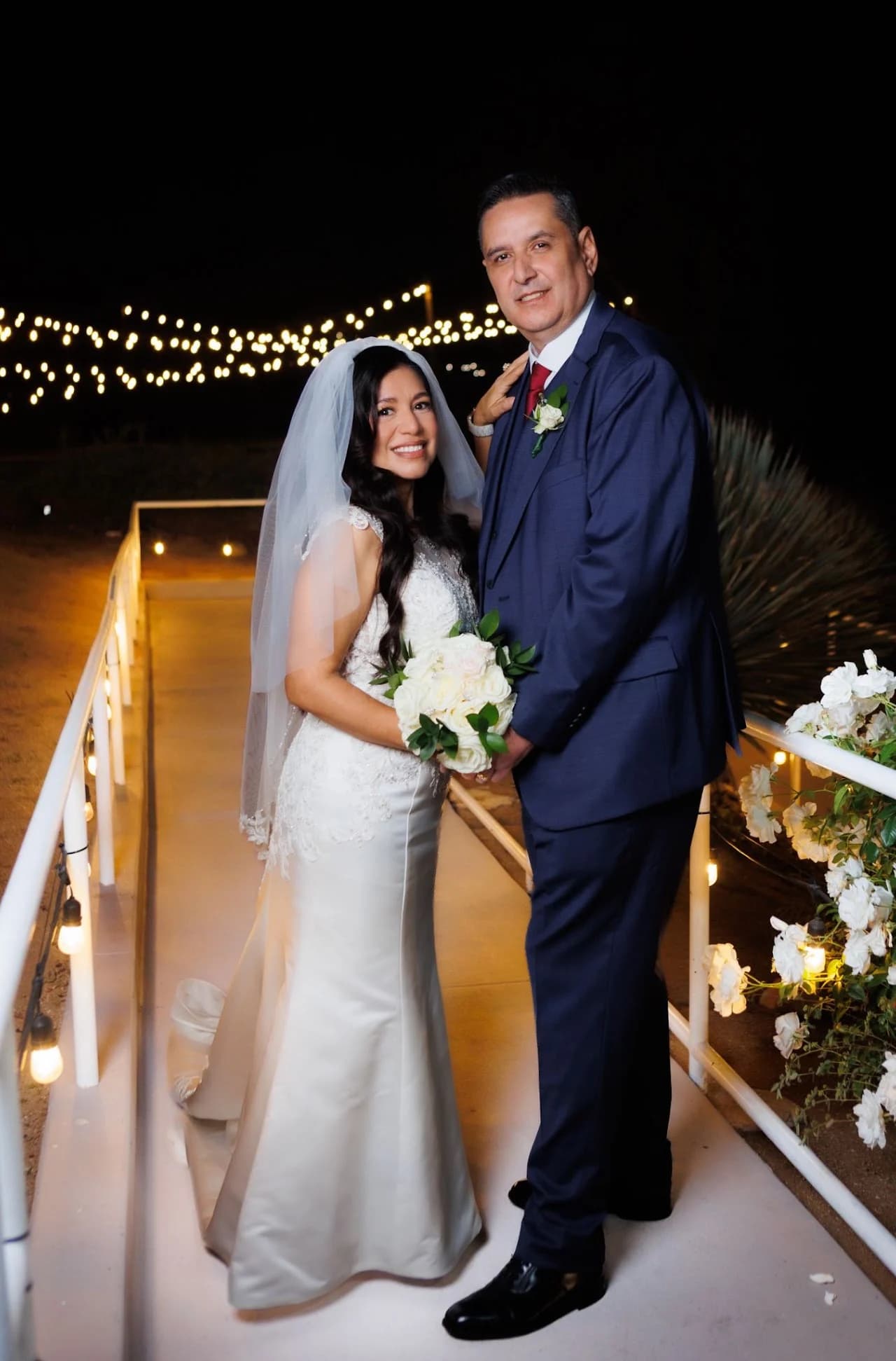 Couple framed by the illuminated walkway