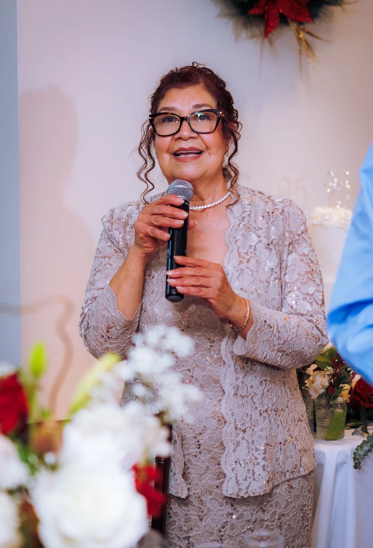 Guest holding a microphone during the celebration