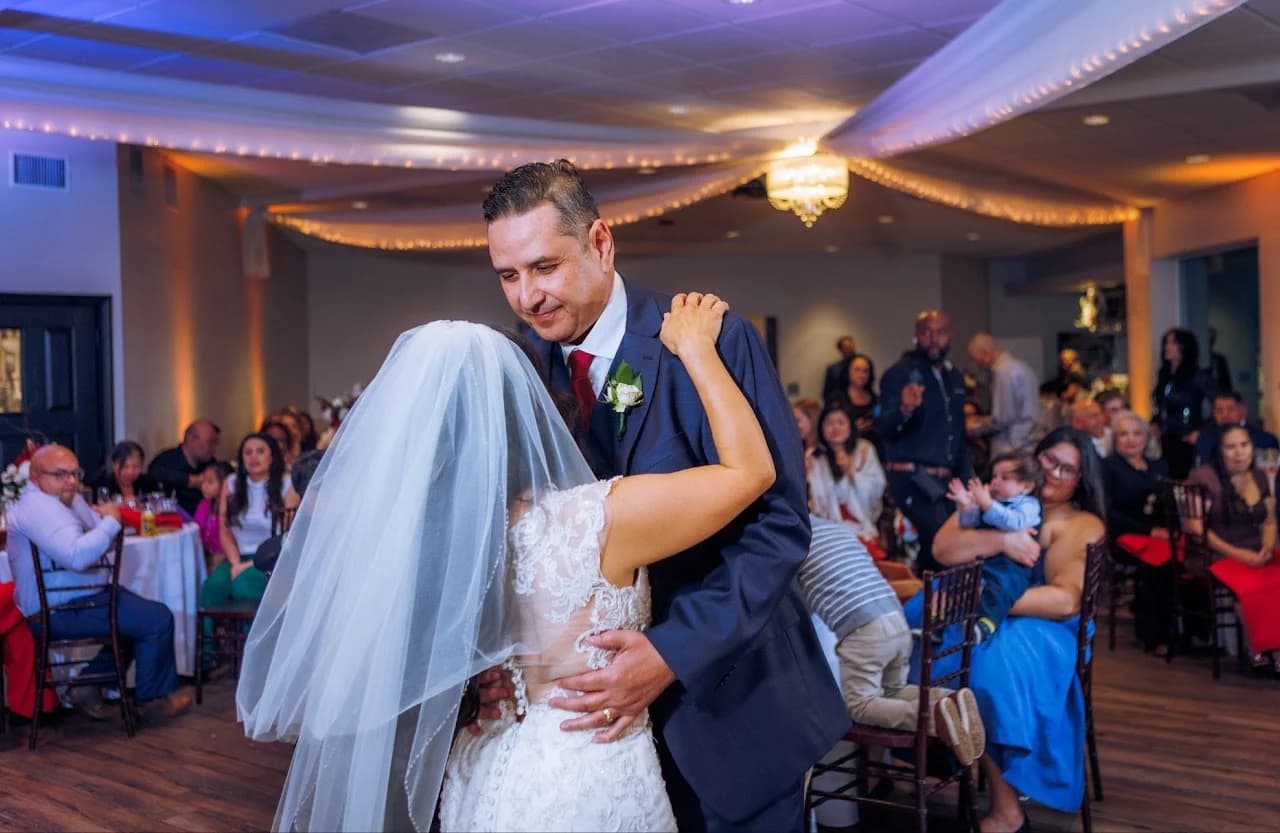 Couple dancing among their guests