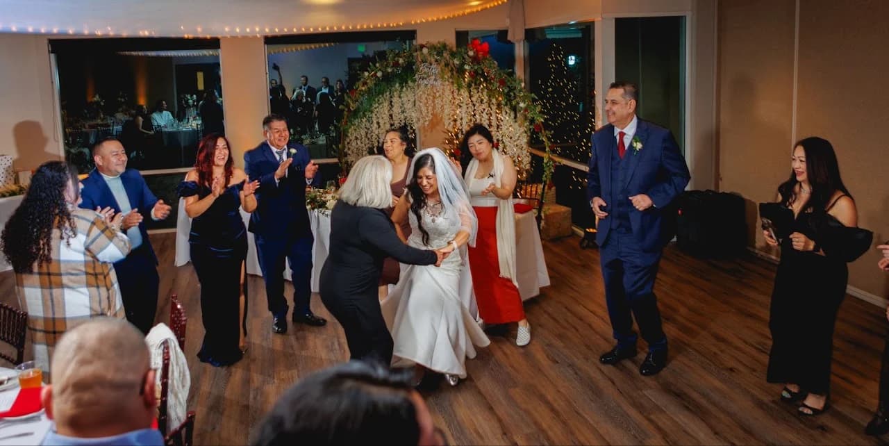 Guests dancing together in the reception room