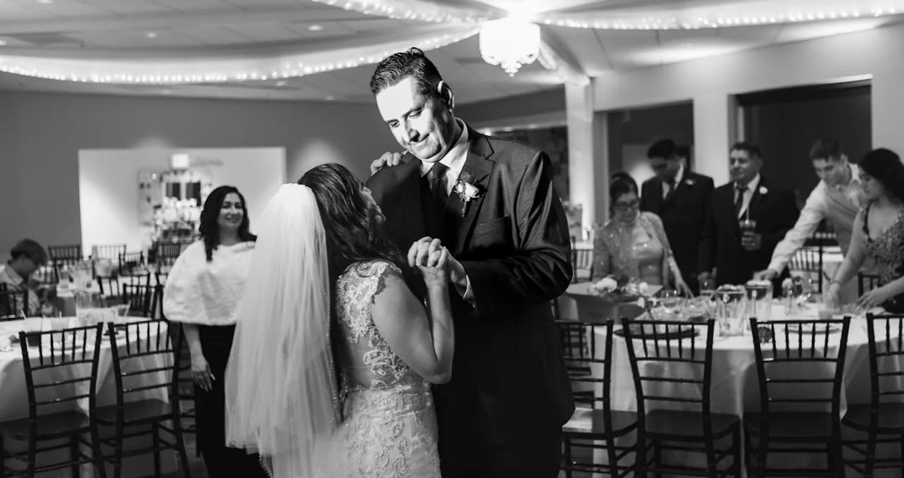 Black-and-white view of the couple and guests