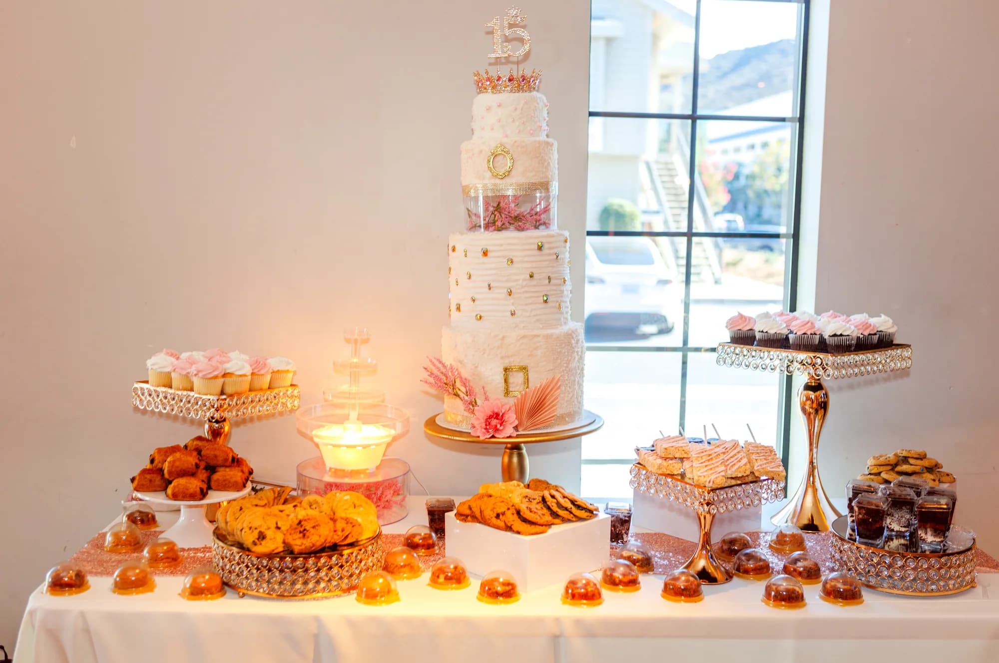 Cake and desserts beside a sunlit window