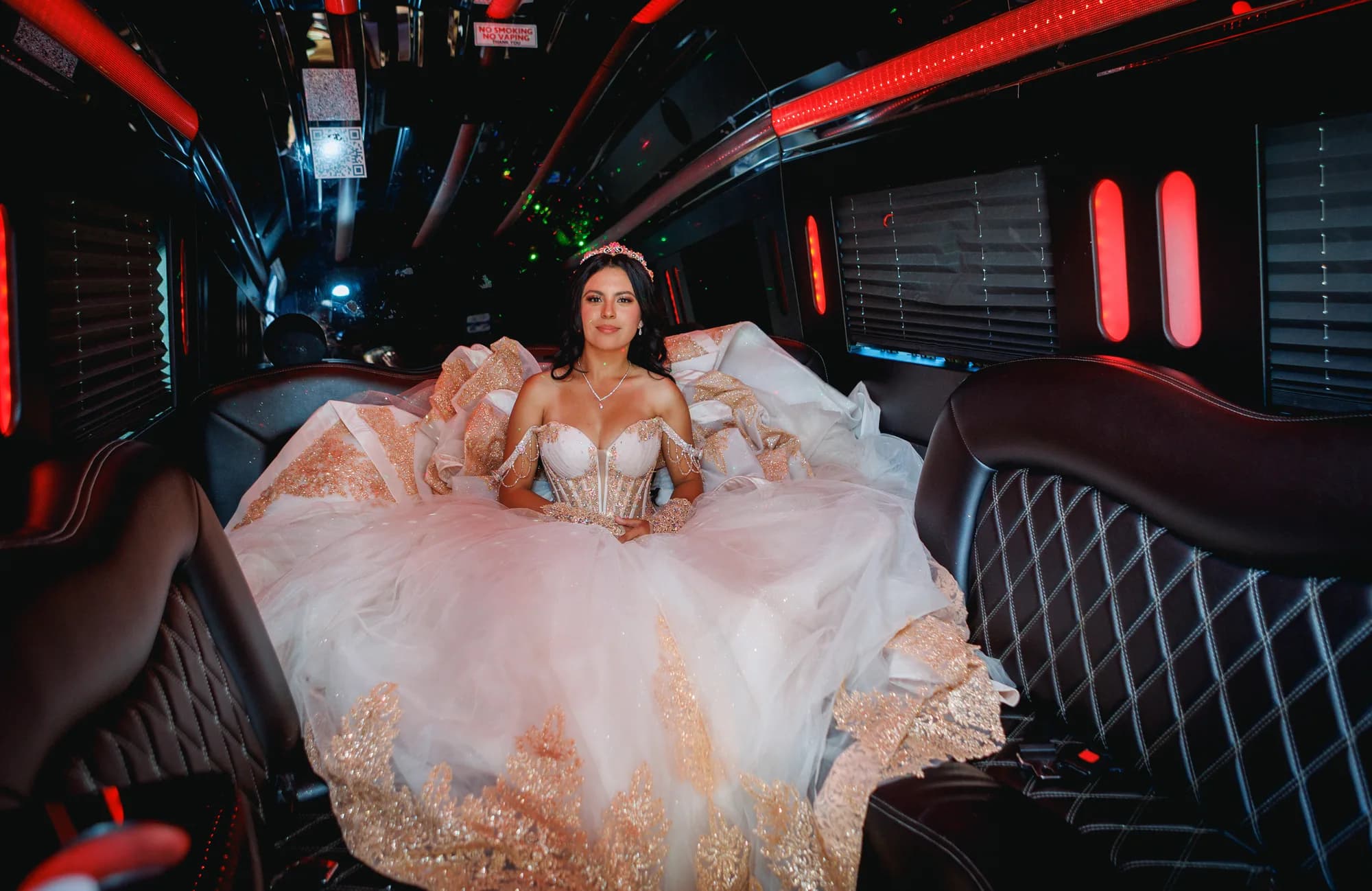 Wide portrait of Isabella and her full skirt inside the party vehicle