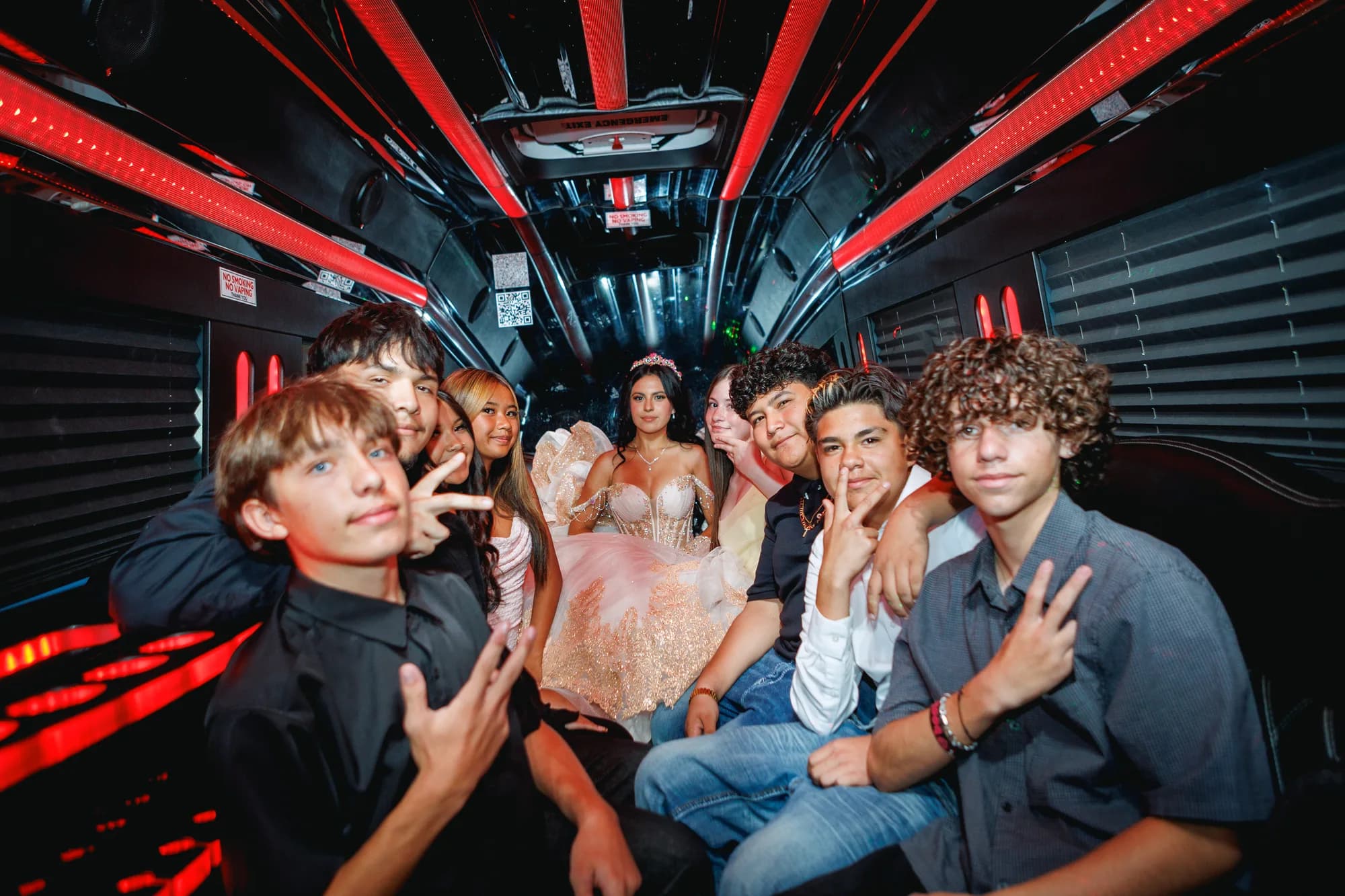 Isabella celebrating with friends inside the party vehicle
