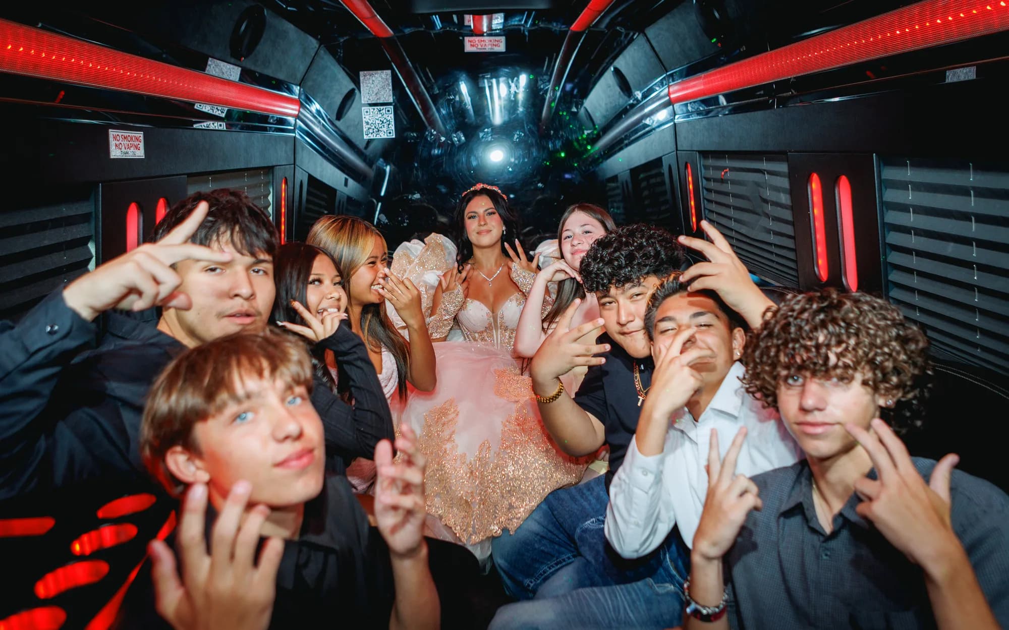 Friends posing together inside the party vehicle