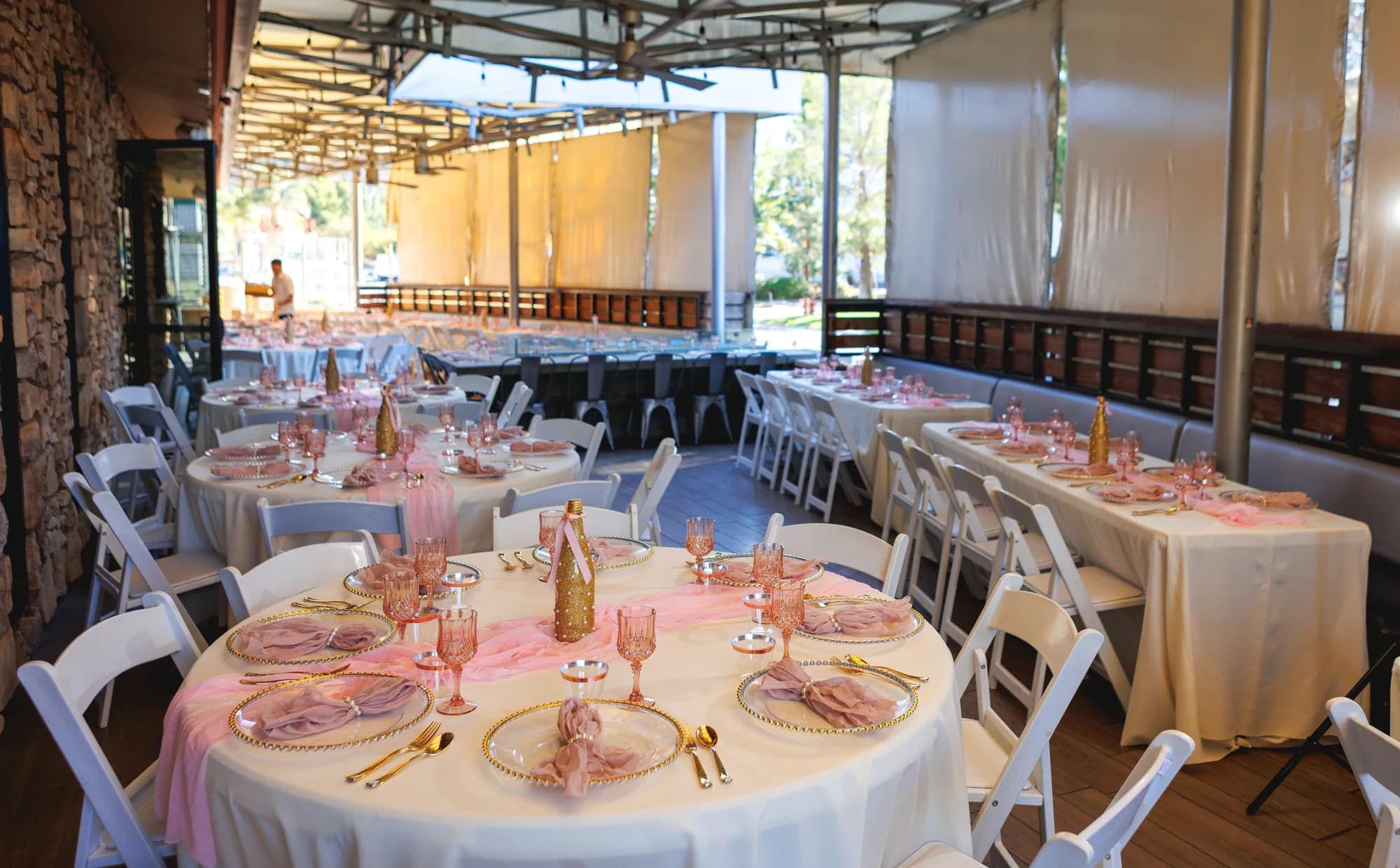Reception tables arranged inside the loft for Isabella’s quinceañera