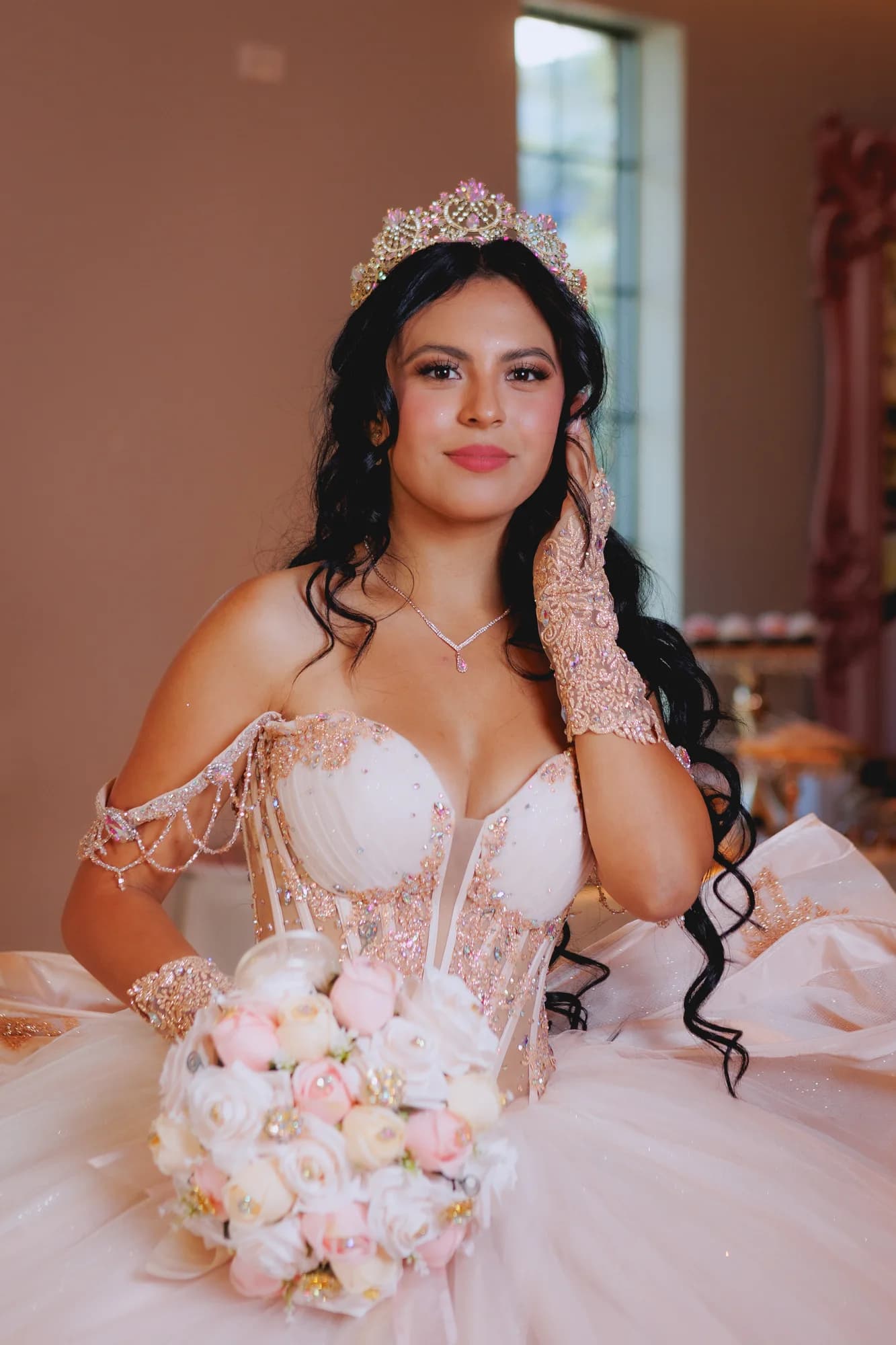 Portrait of Isabella holding her pink and ivory bouquet