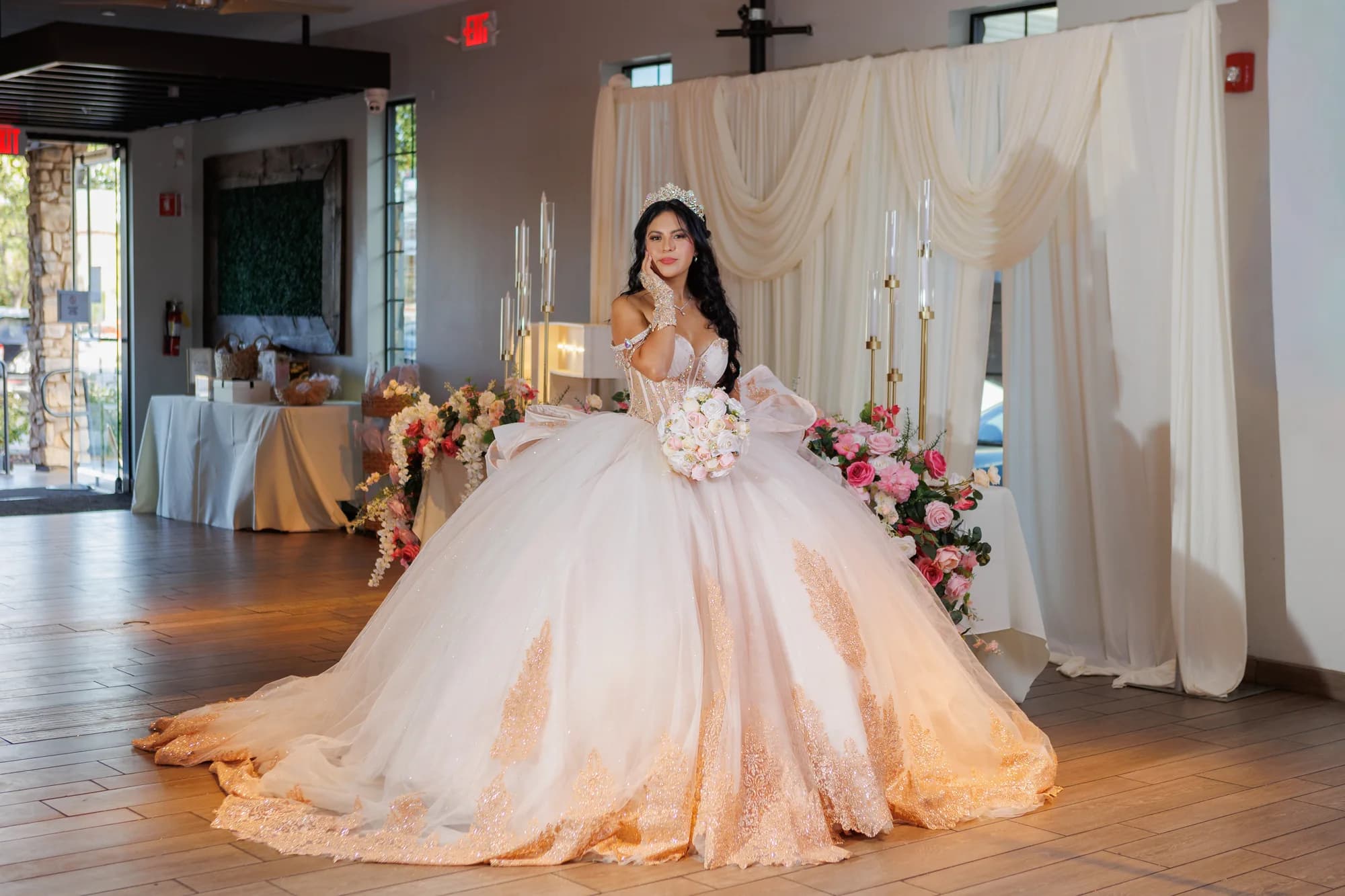Isabella’s gown spread across the floor beside the floral table