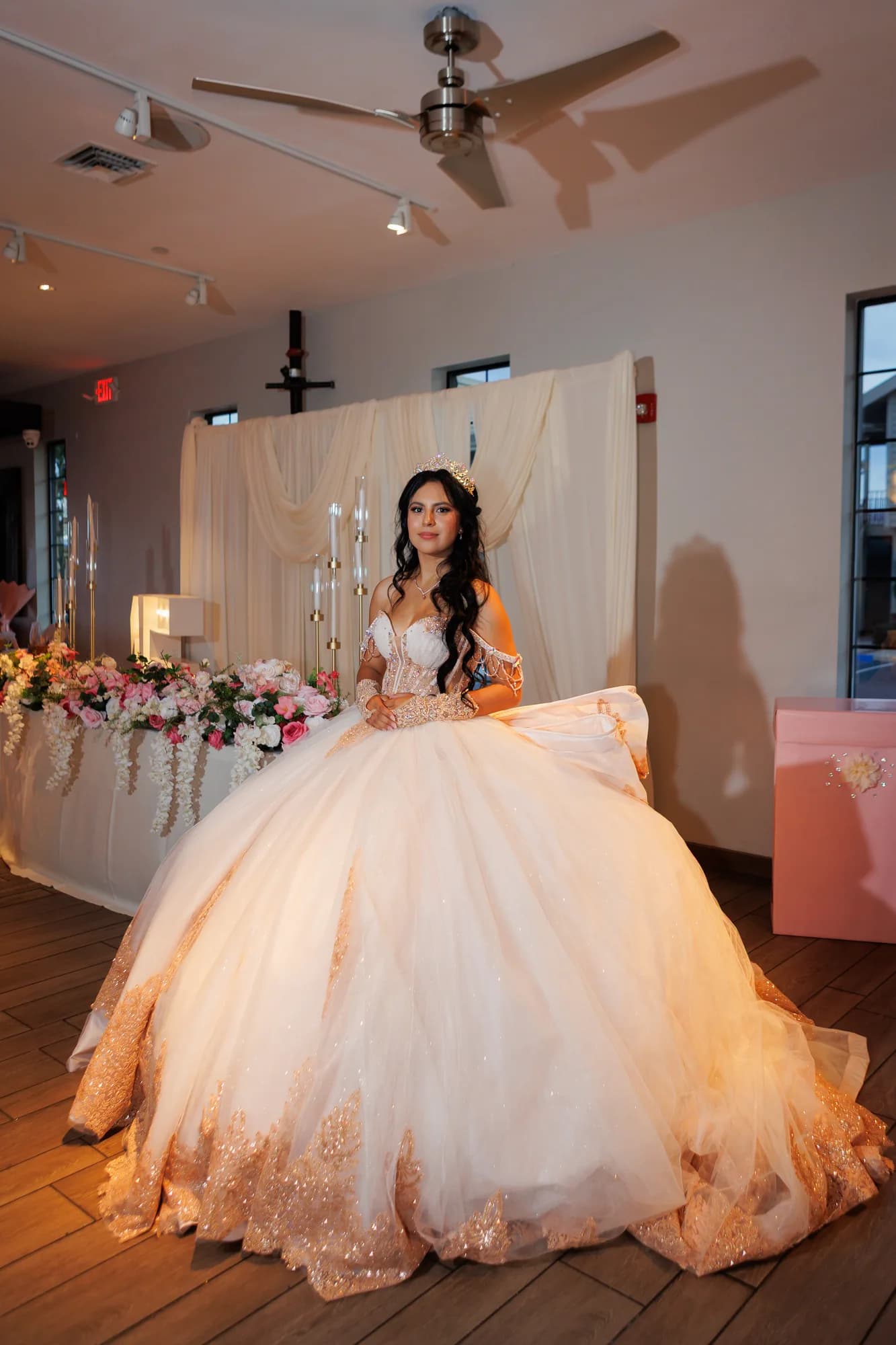 Full-length portrait of Isabella beside the reception flowers