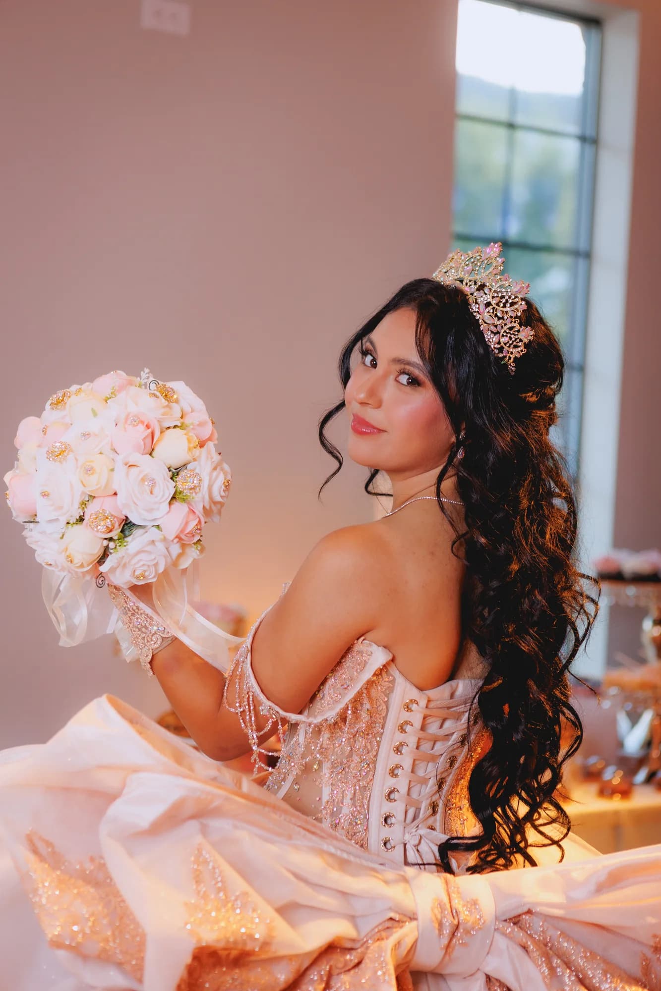 Isabella looking toward the window with her bouquet