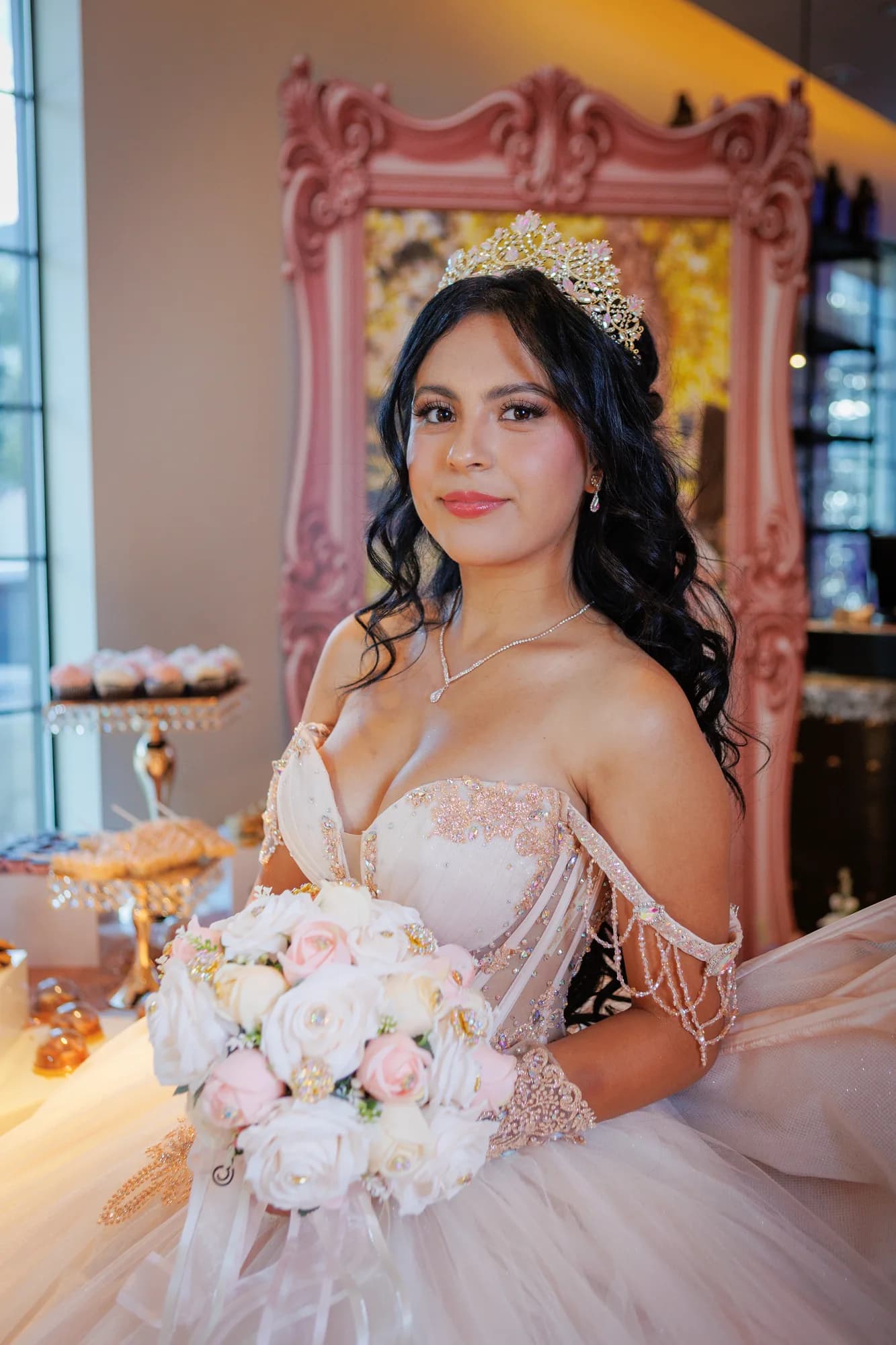Close portrait of Isabella seated with her bouquet