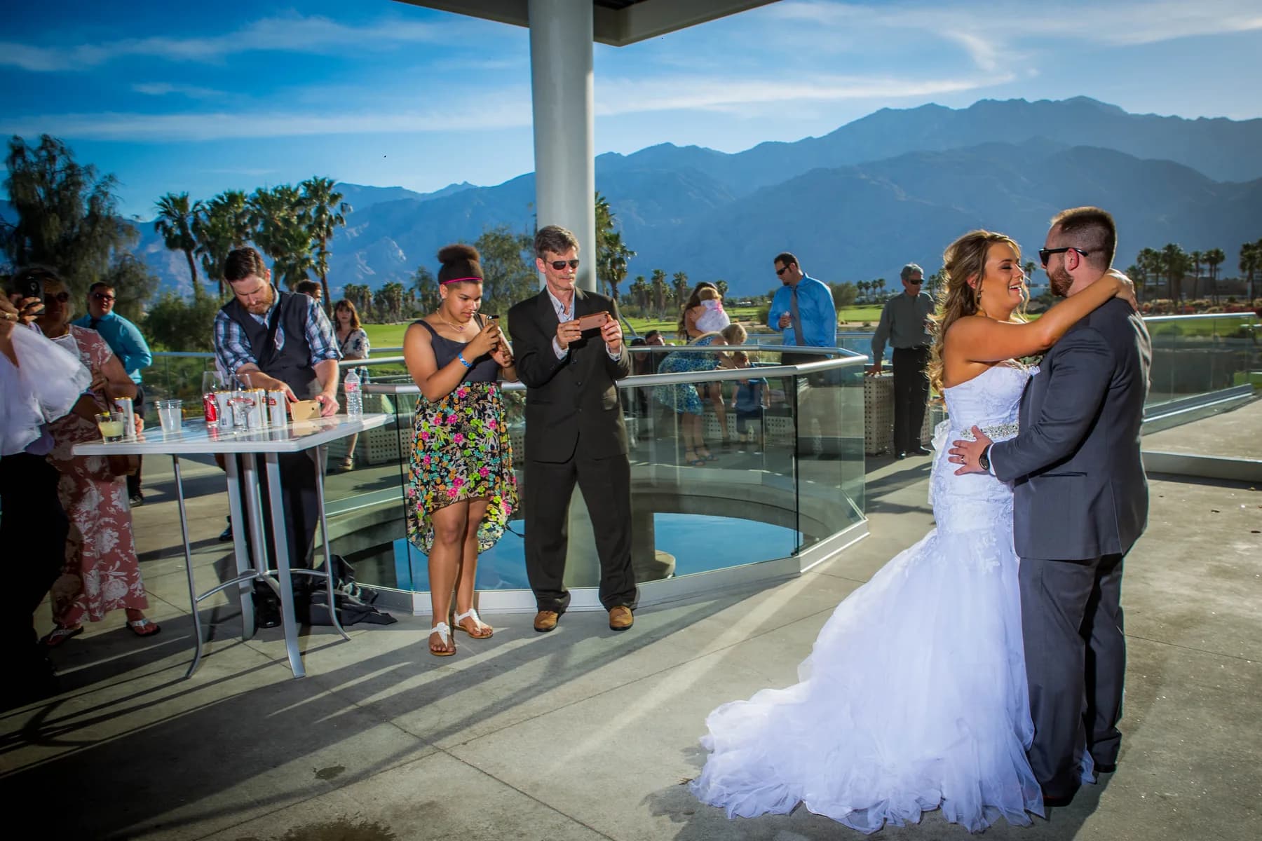 Stephen and Heather dancing on a terrace with the San Jacinto Mountains behind them