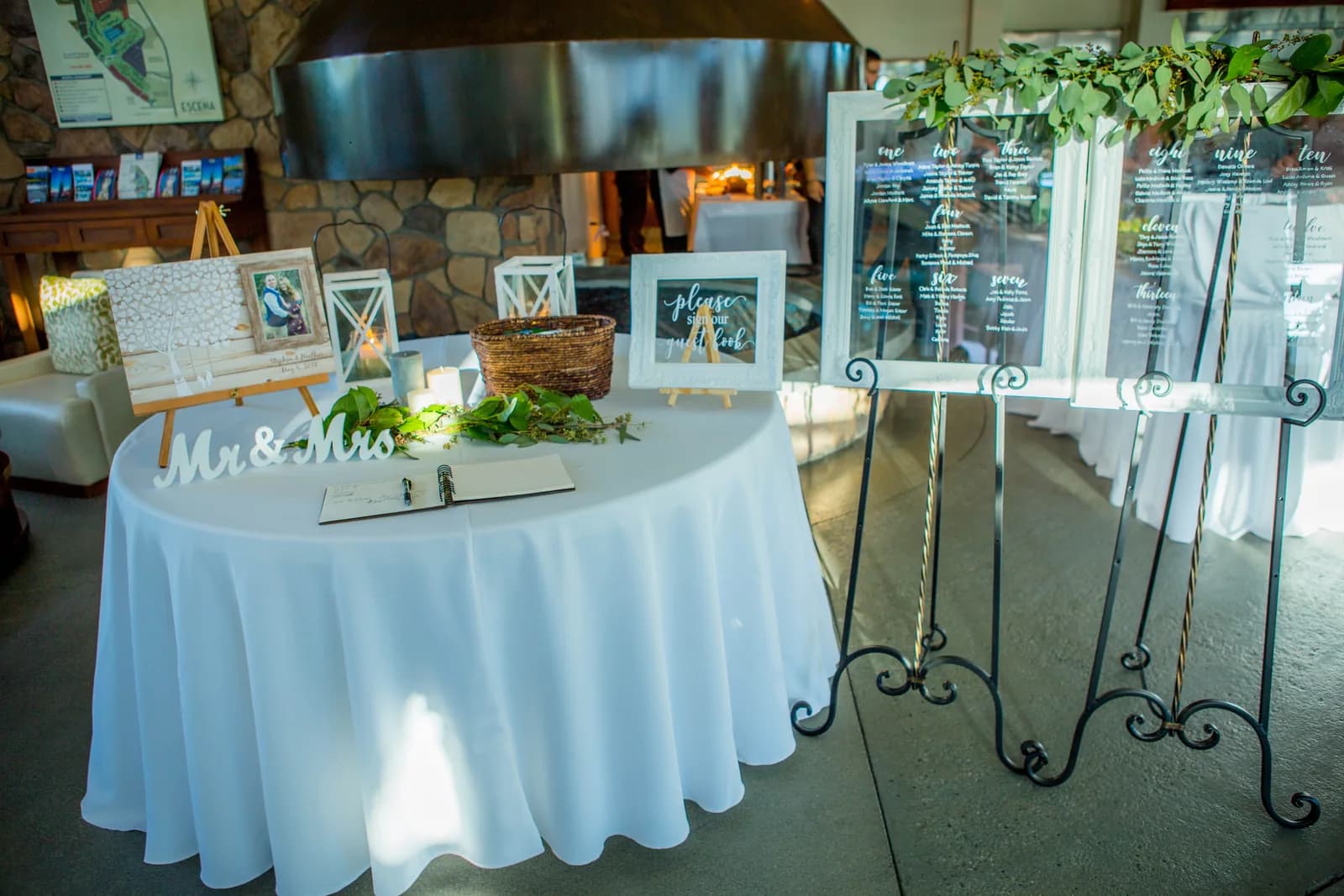 Wedding memory table arranged beside the reception room windows