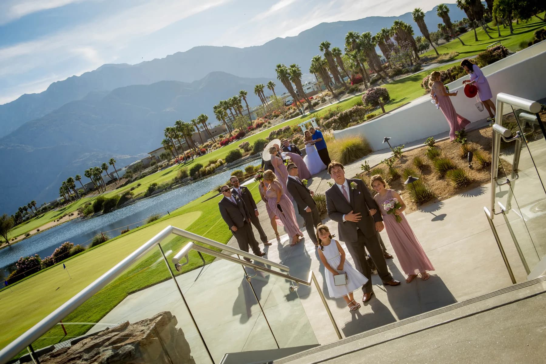 Wedding party walking toward a terrace overlooking the Palm Springs landscape