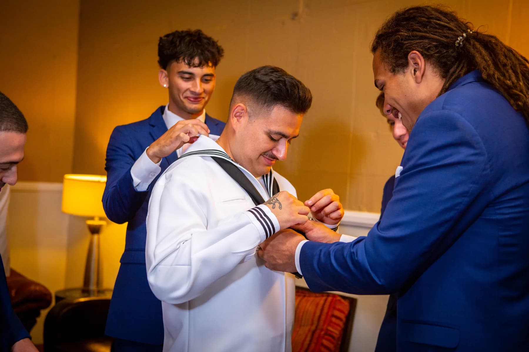 Wedding attendants helping with final preparations before the ceremony