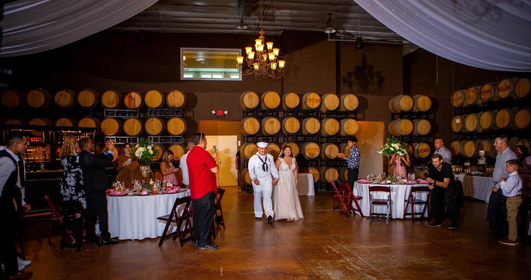 Guests gathered during a Leoness Cellars barrel-room reception