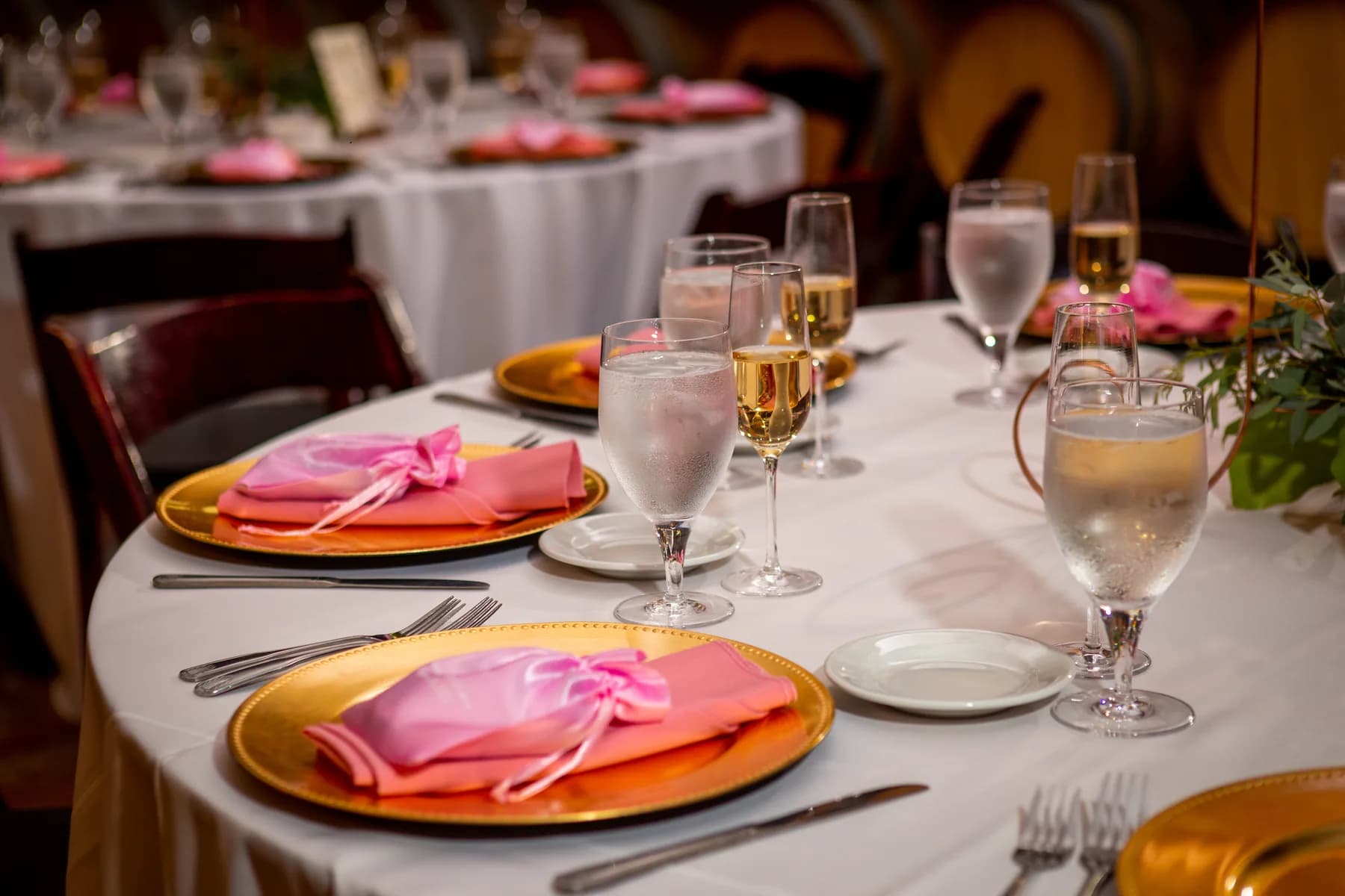 Reception table set with blush napkins and glassware