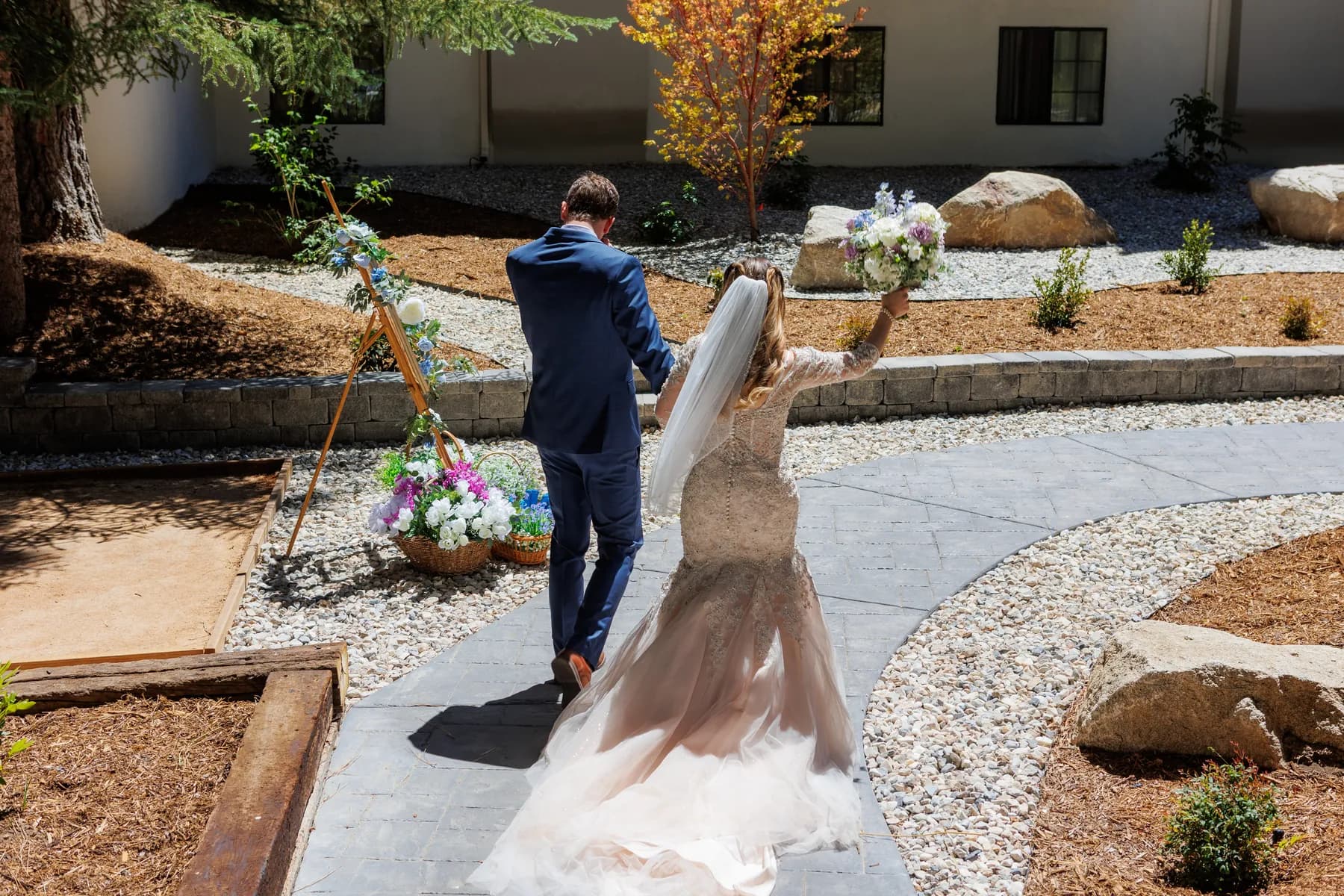 Gloria and Ryan walking together along a curved outdoor path