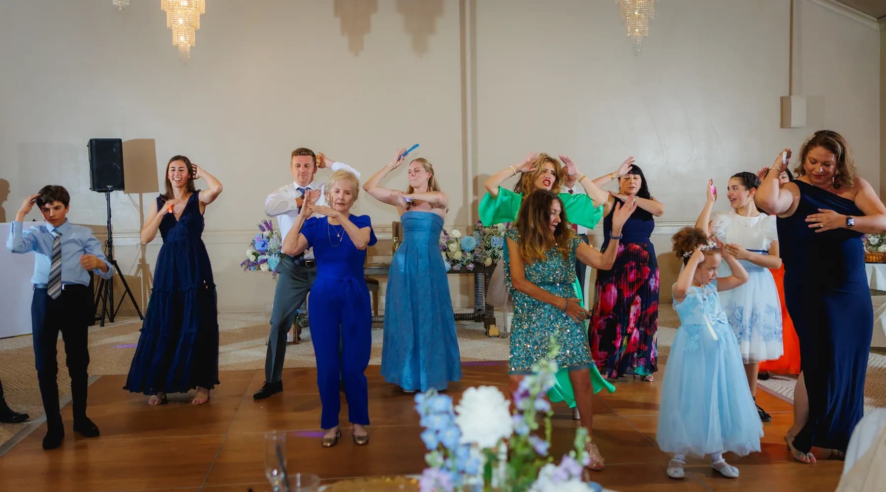 Guests dancing together on the reception floor