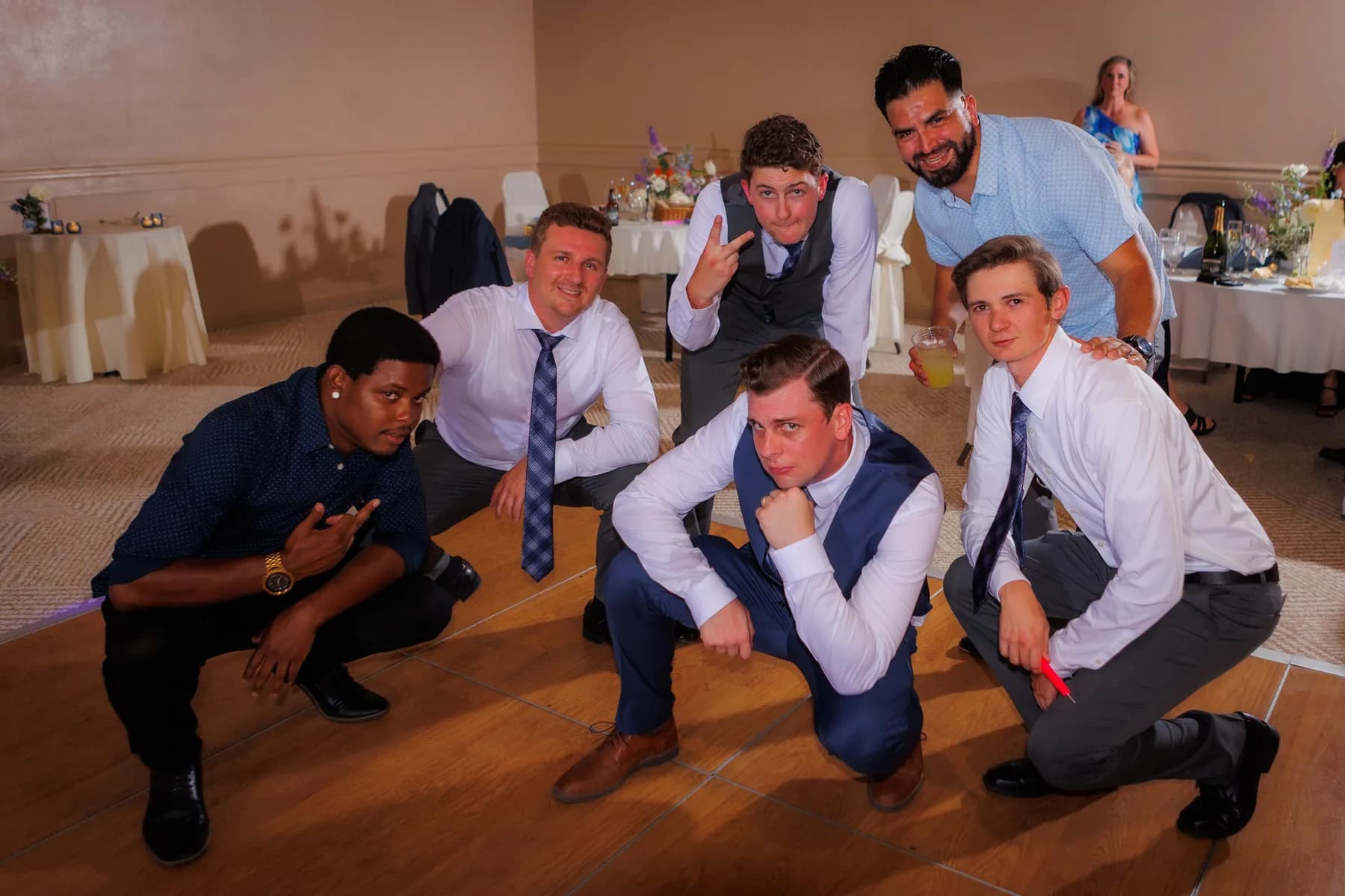 Guests posing playfully on the dance floor