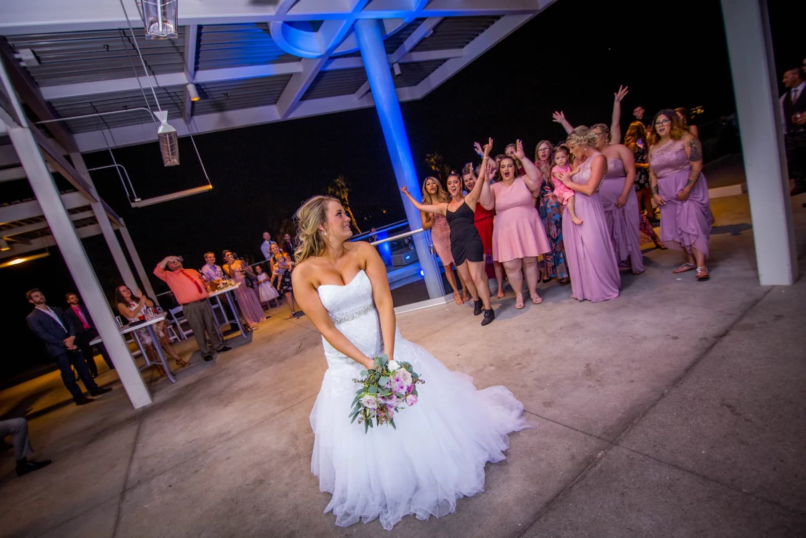 Heather preparing to toss her bouquet during the reception