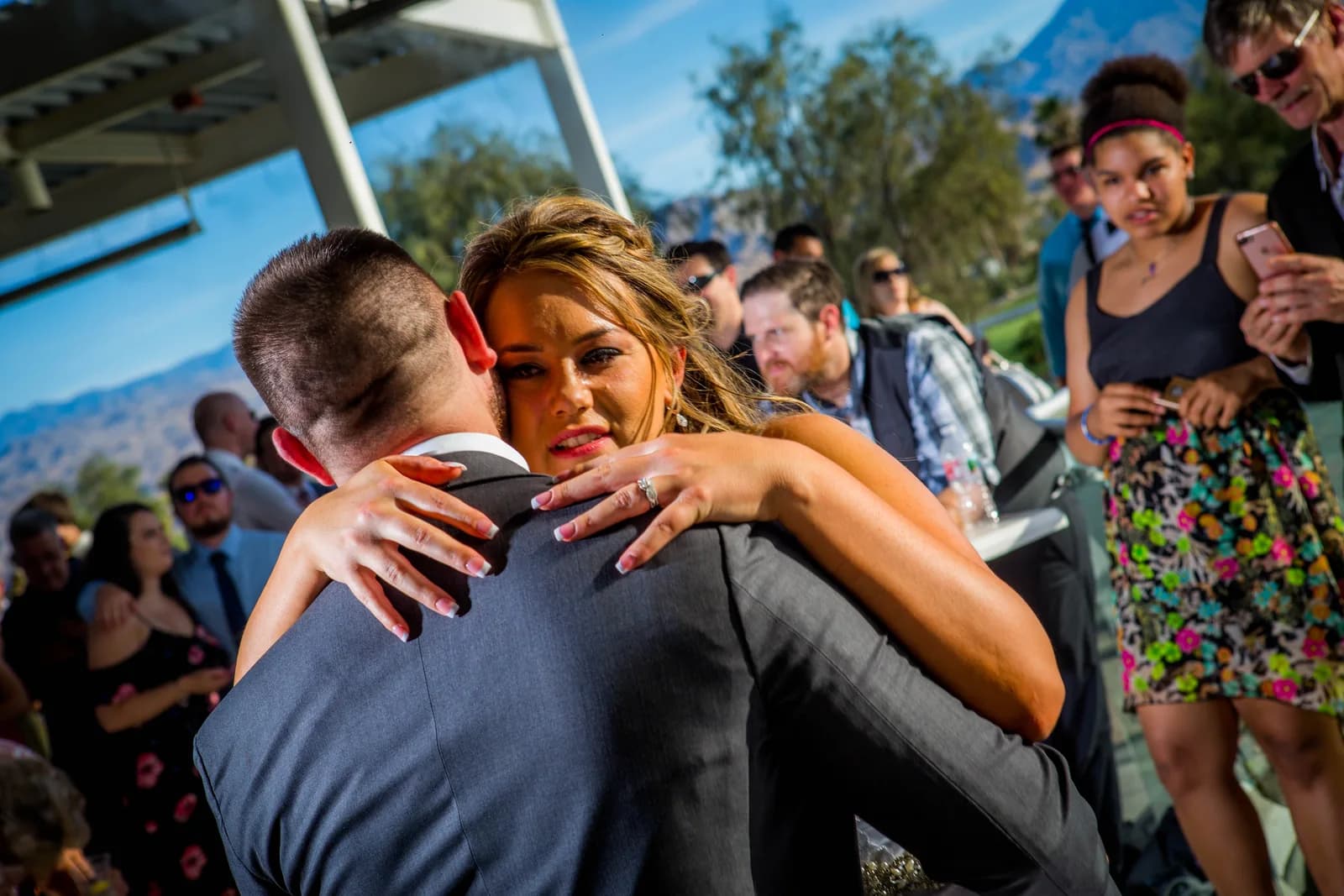 Heather embracing a guest during the celebration