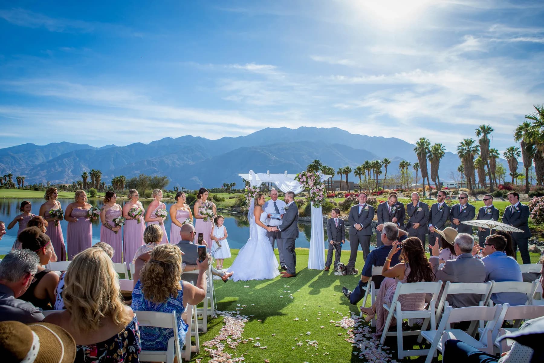 Outdoor wedding ceremony at Escena Golf Club with mountains in the distance